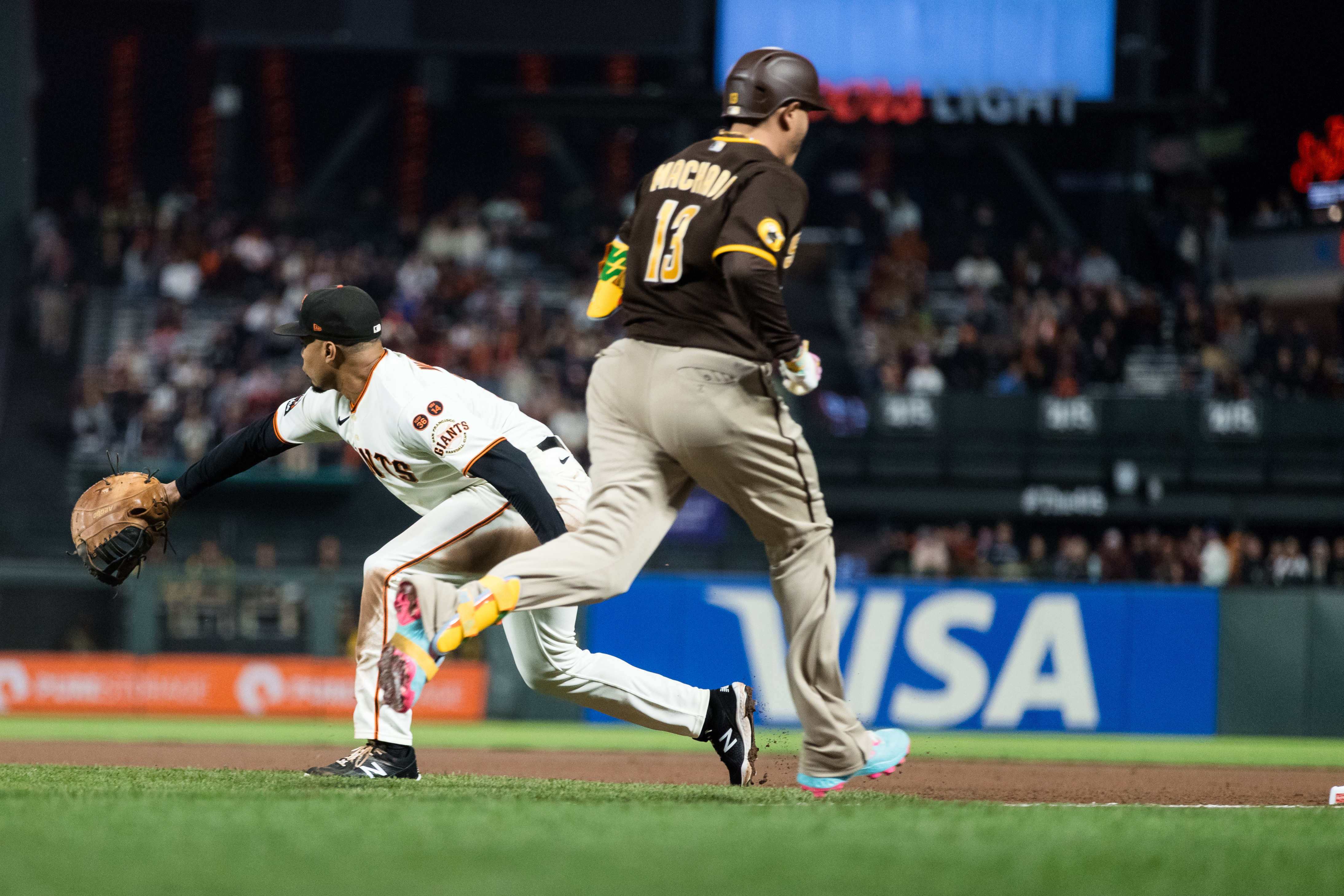 Padres edge Giants in 10, technically remain alive