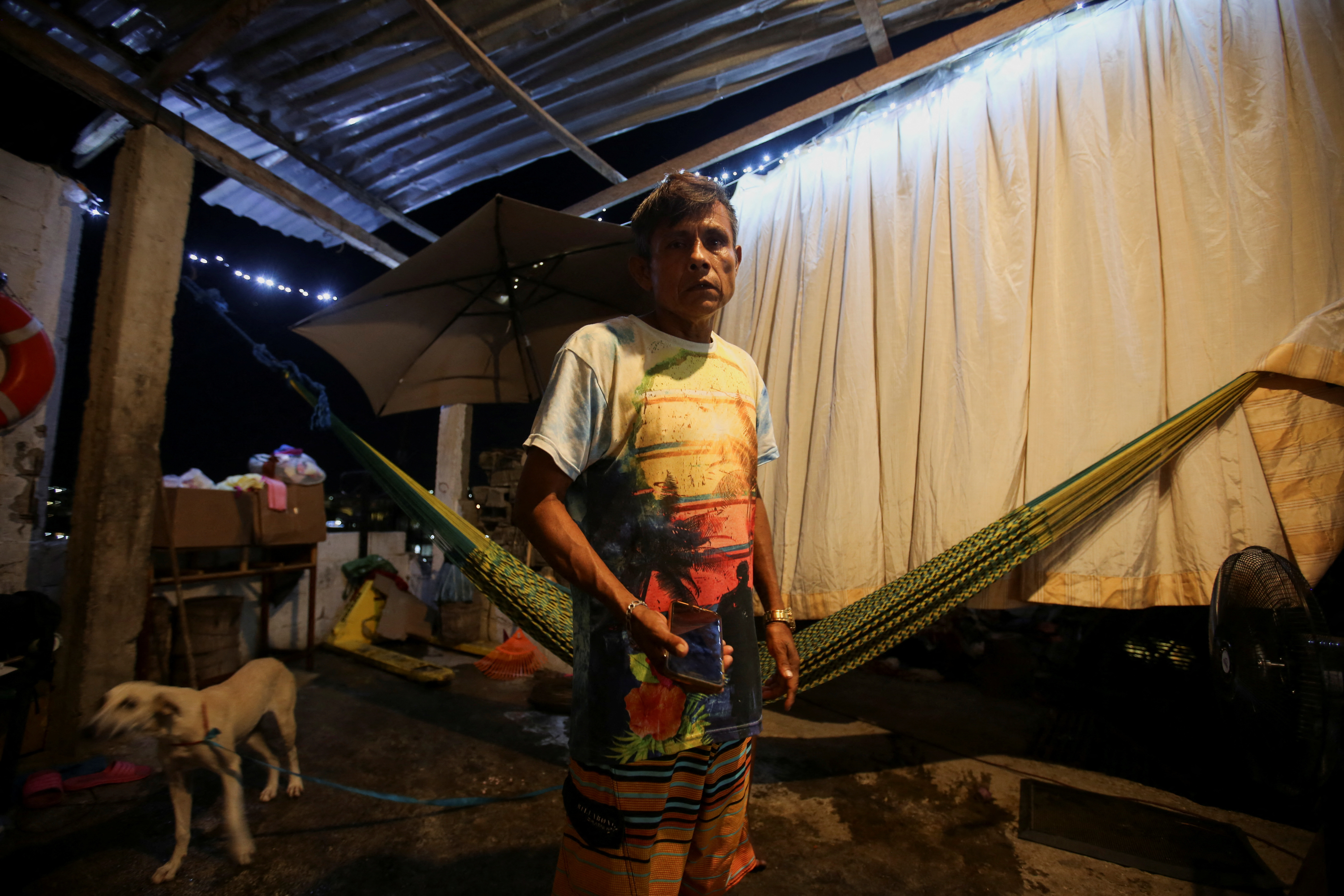 Fisherman Juan Pablo Garcia Atrixco, who lost his house during Hurricane Otis, with his family, in Acapulco