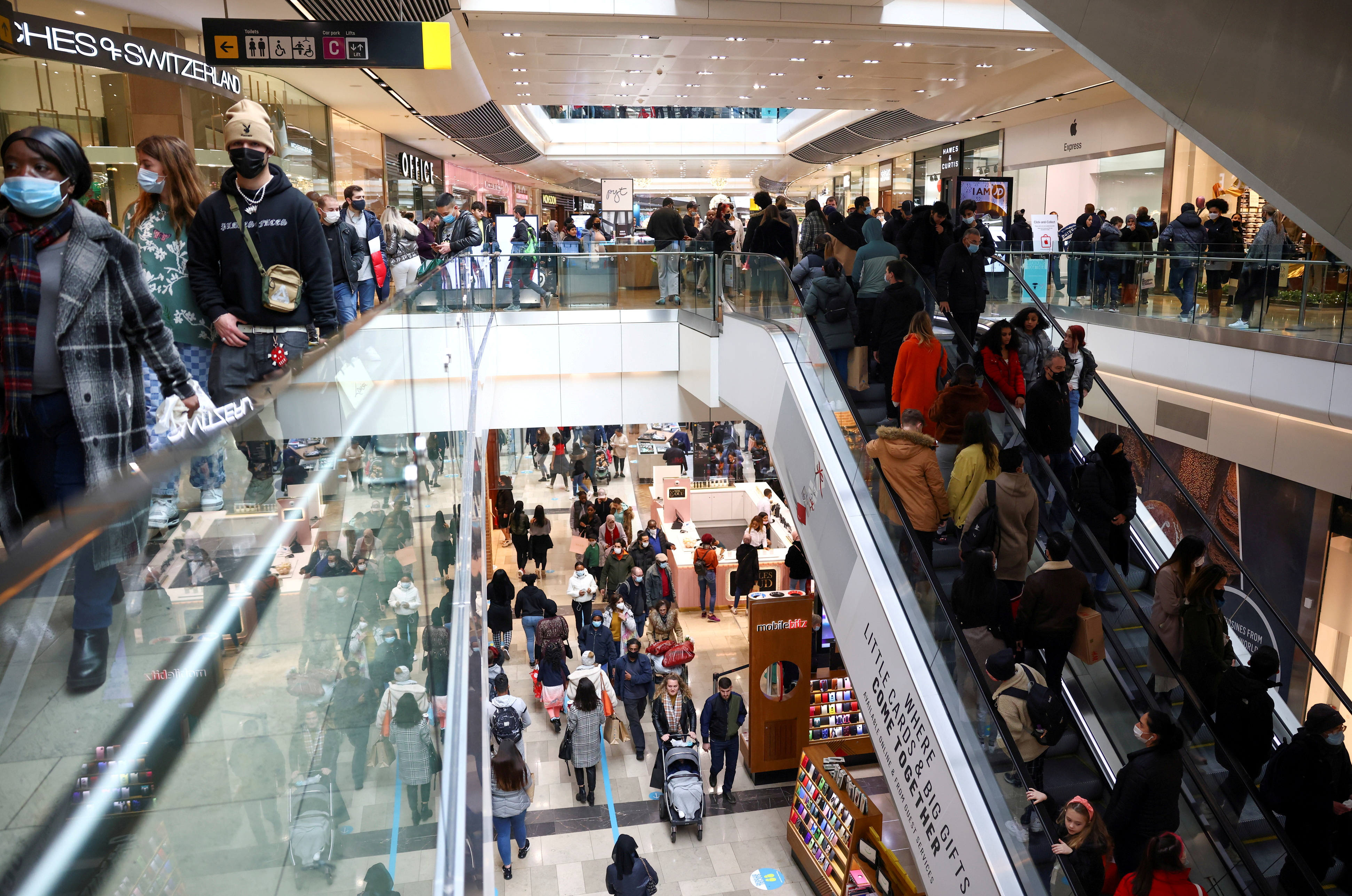 People walk through the Westfield Stratford City shopping centre, amid the coronavirus disease (COVID-19) outbreak in London, Britain, December 5, 2020. REUTERS/Henry Nicholls//File Photo