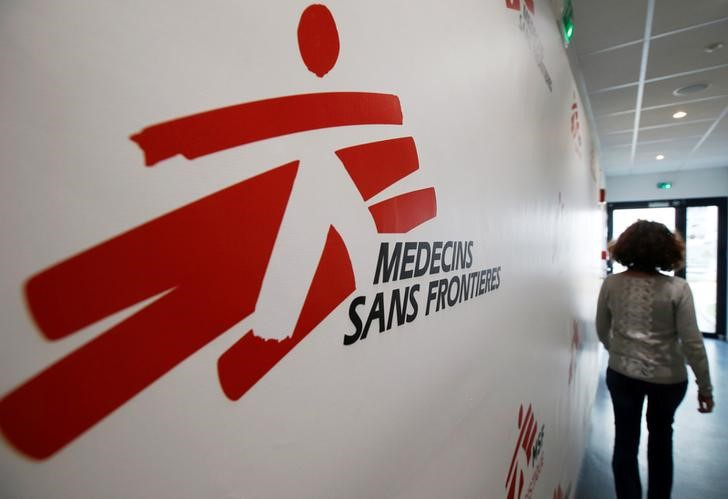 An employee of Medecins Sans Frontieres walks in a corridor at the international medical humanitarian organisation MSF logistique centre in Merignac