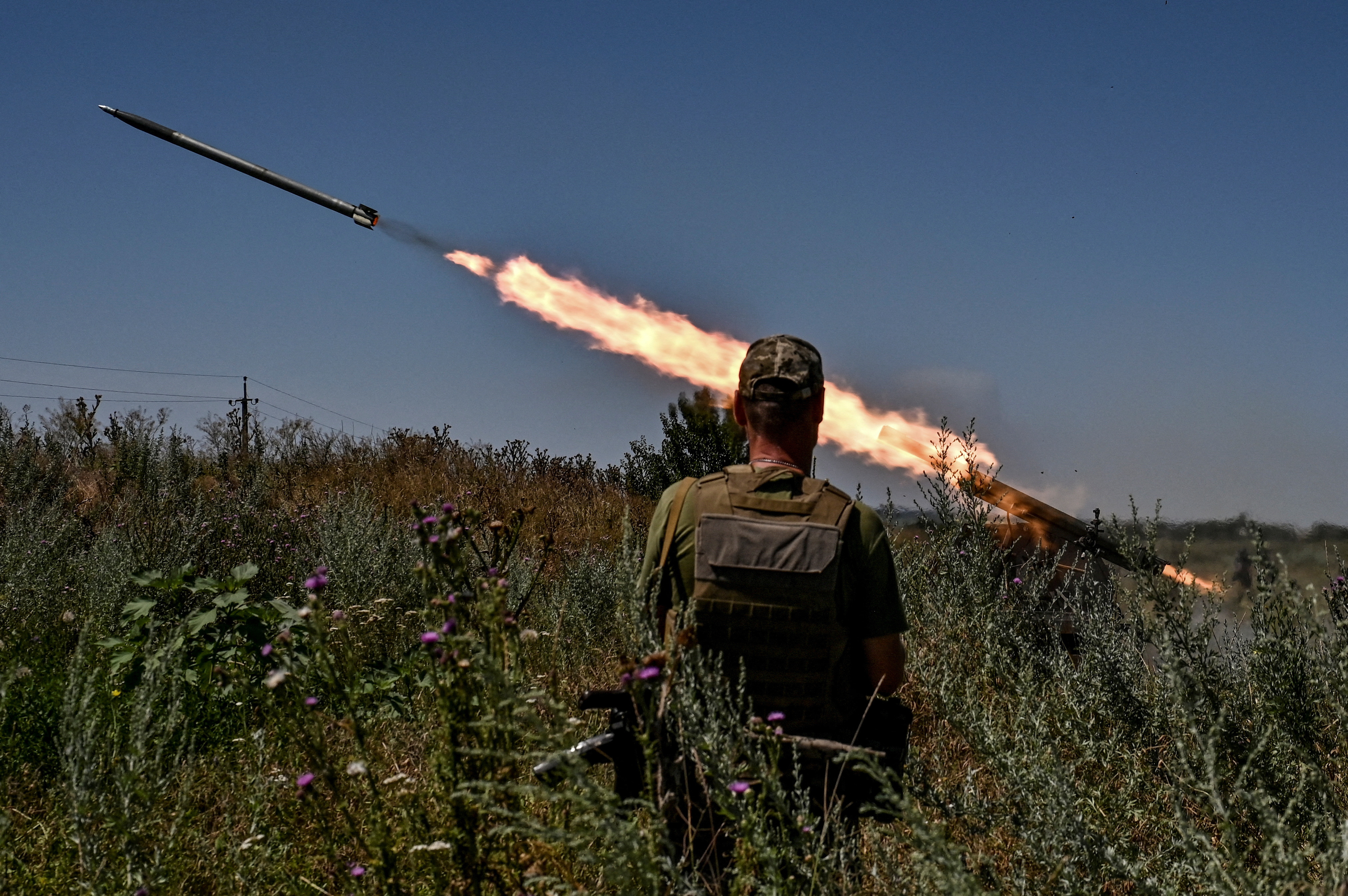 Ukrainian servicemen fire a Partyzan small MLRS toward Russian troops near a front line in Zaporizhzhia region