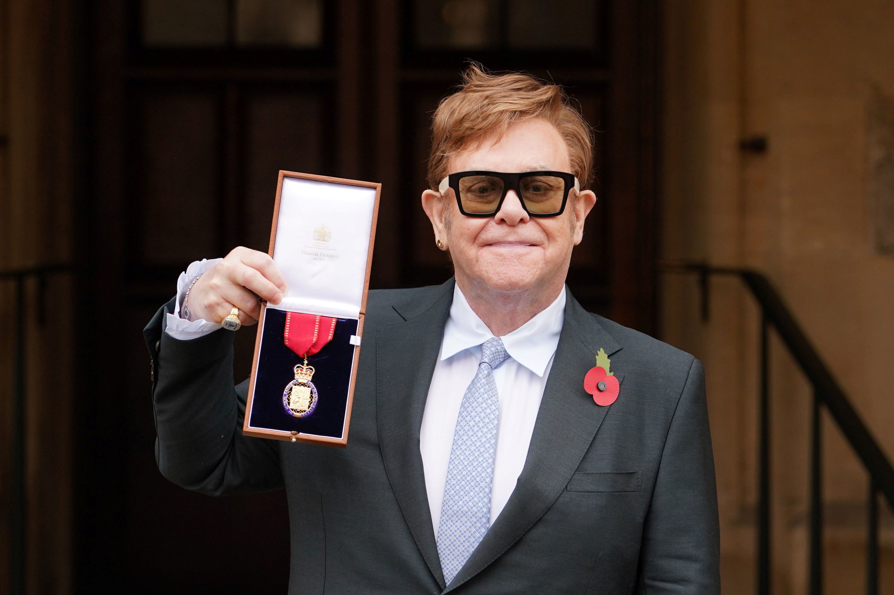 Musician Elton John poses after being made a member of the Order of the Companions of Honour for services to Music and to Charity during an investiture ceremony at Windsor Castle in Windsor, Britain, November 10, 2021. Dominic Lipinski/Pool via REUTERS