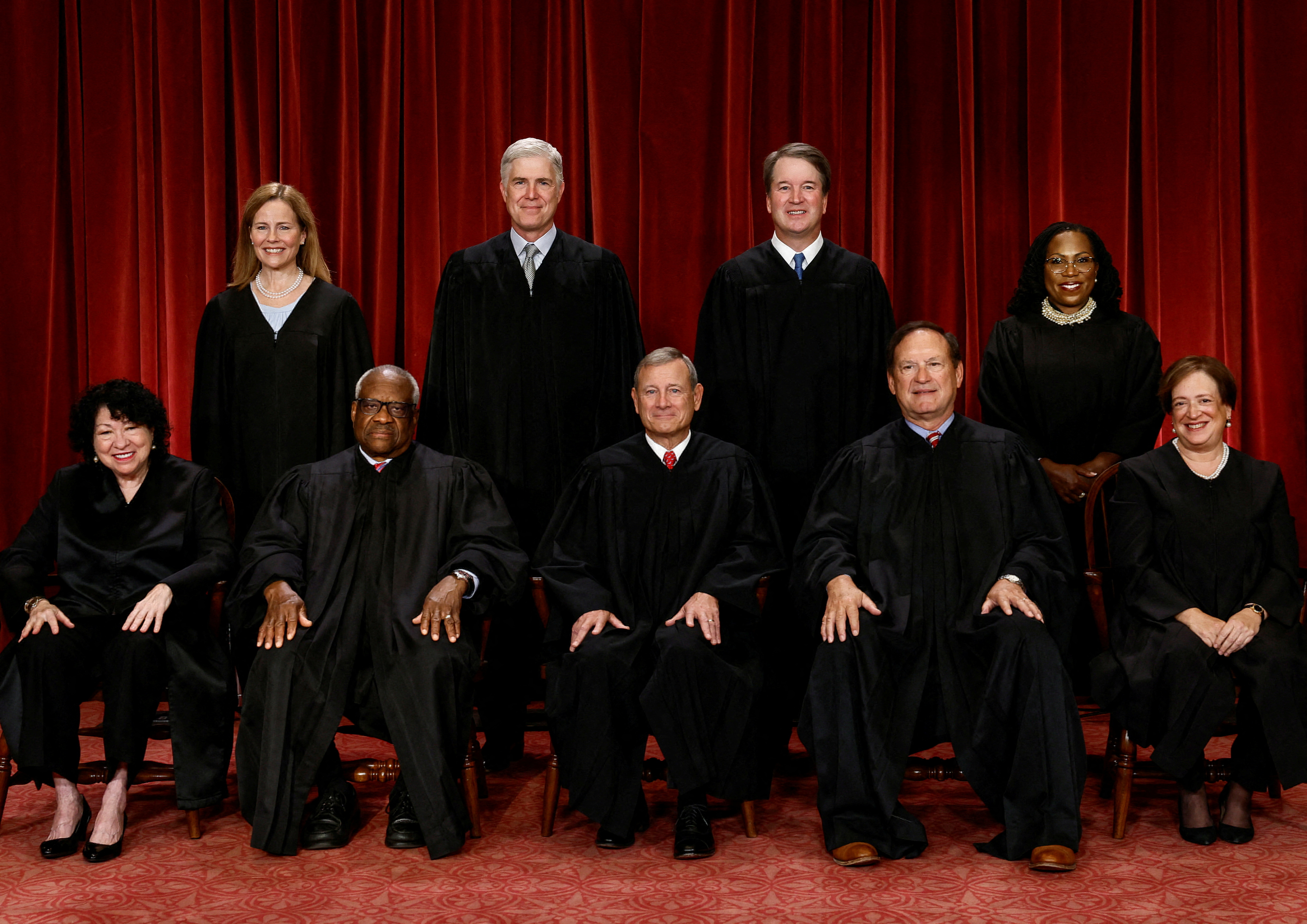 U.S. Supreme Court justices pose for their group portrait at the Supreme Court in Washington