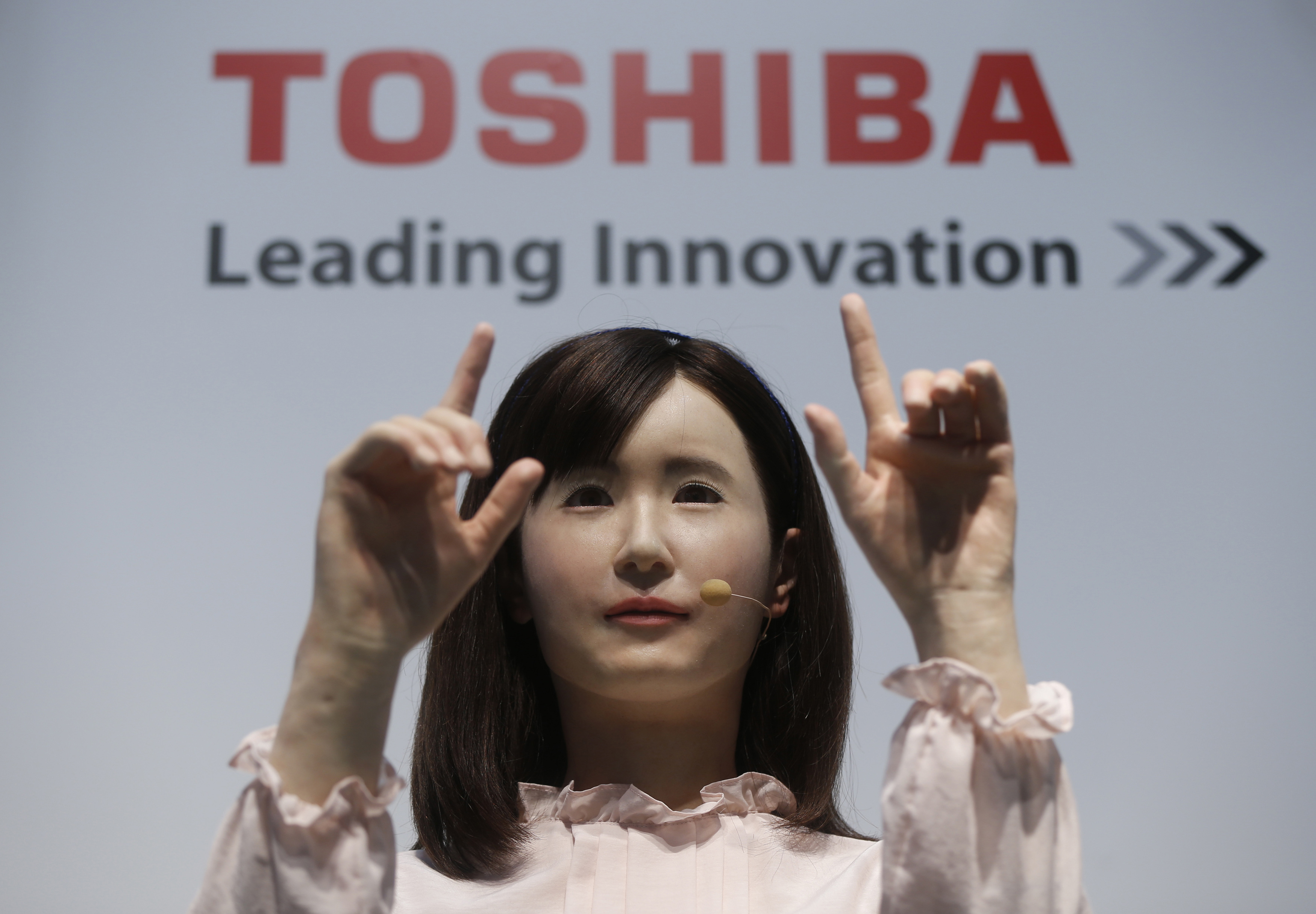 Toshiba Corp. demonstrates its communications android named Ms. Aiko Chihira that can use sign language and introduce itself, at CEATEC JAPAN 2014 in Chiba