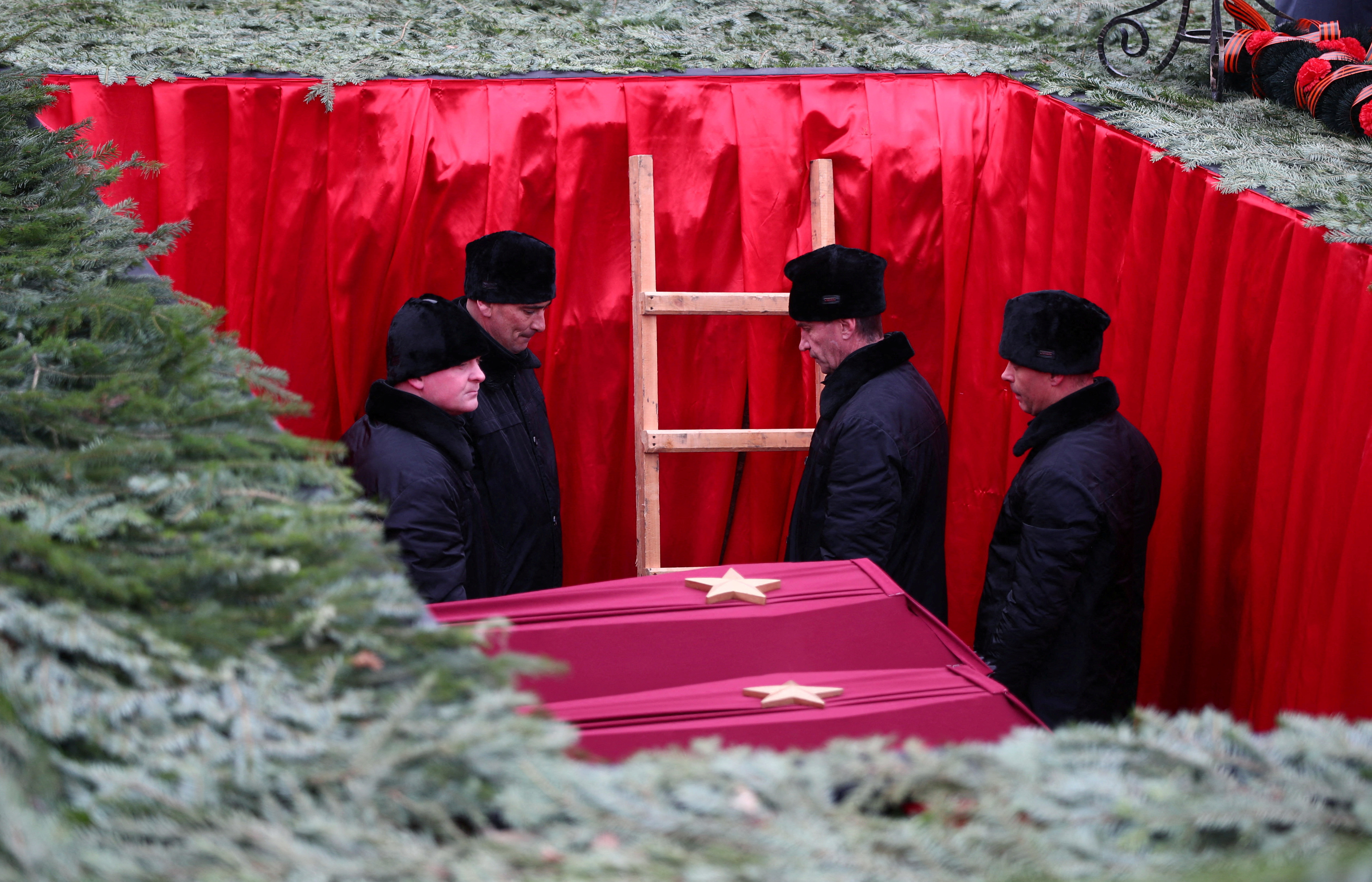 Participants attend a ceremony to rebury the remains of Red Army soldiers killed during World War Two in Volgograd region