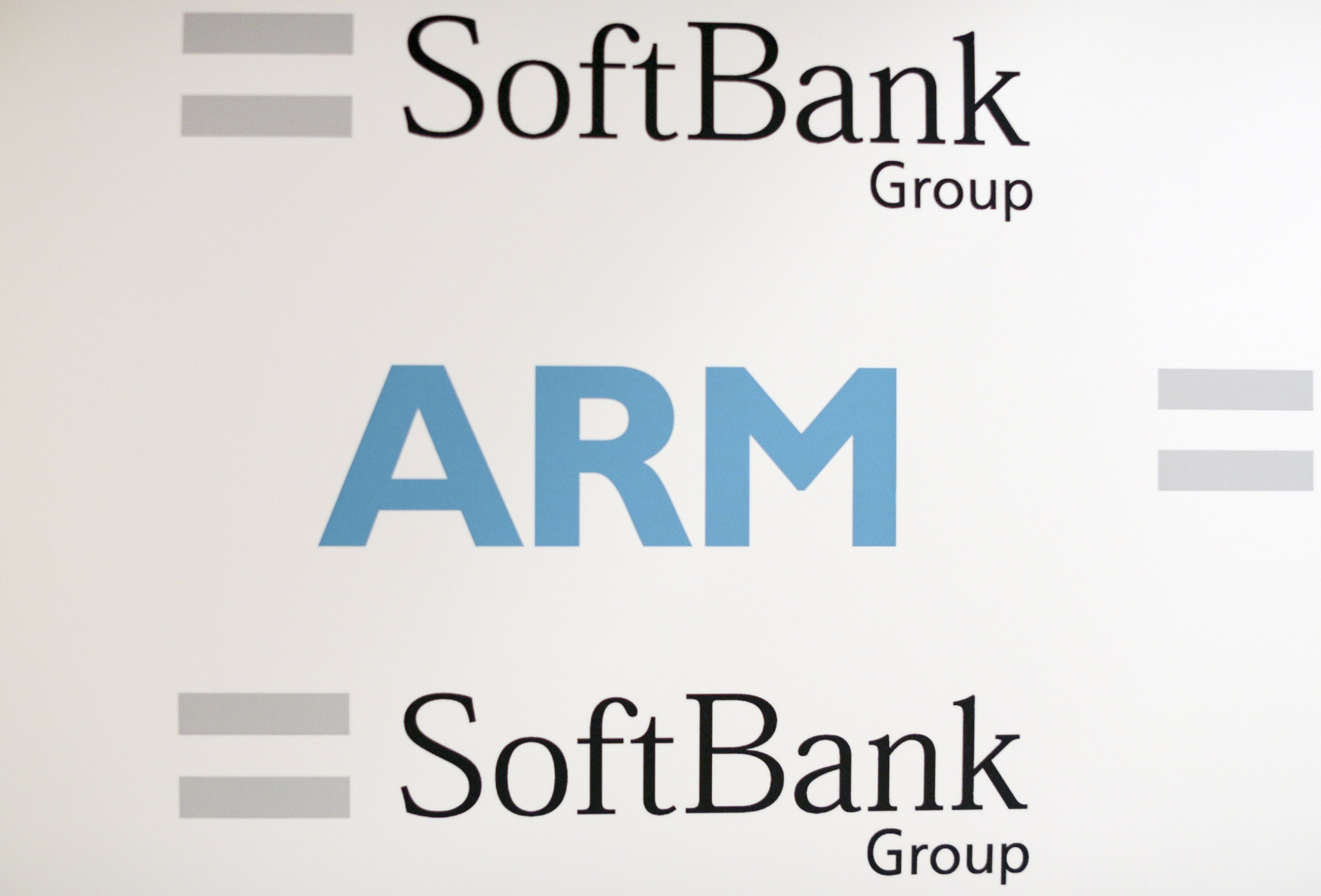 An ARM and SoftBank Group branded board is displayed at a news conference in London