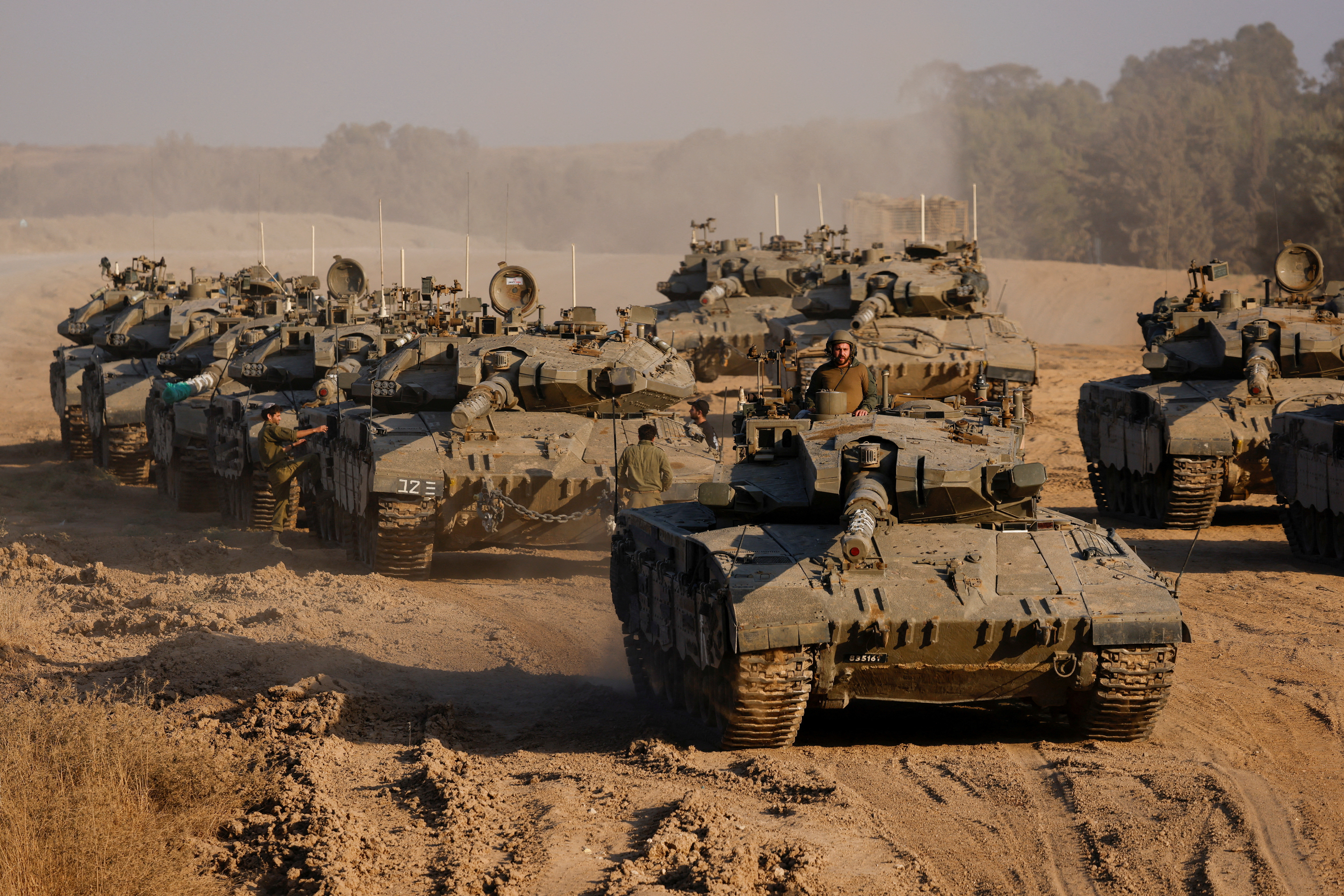Israeli tanks manoeuvre near the Gaza-Israel border, in Israel