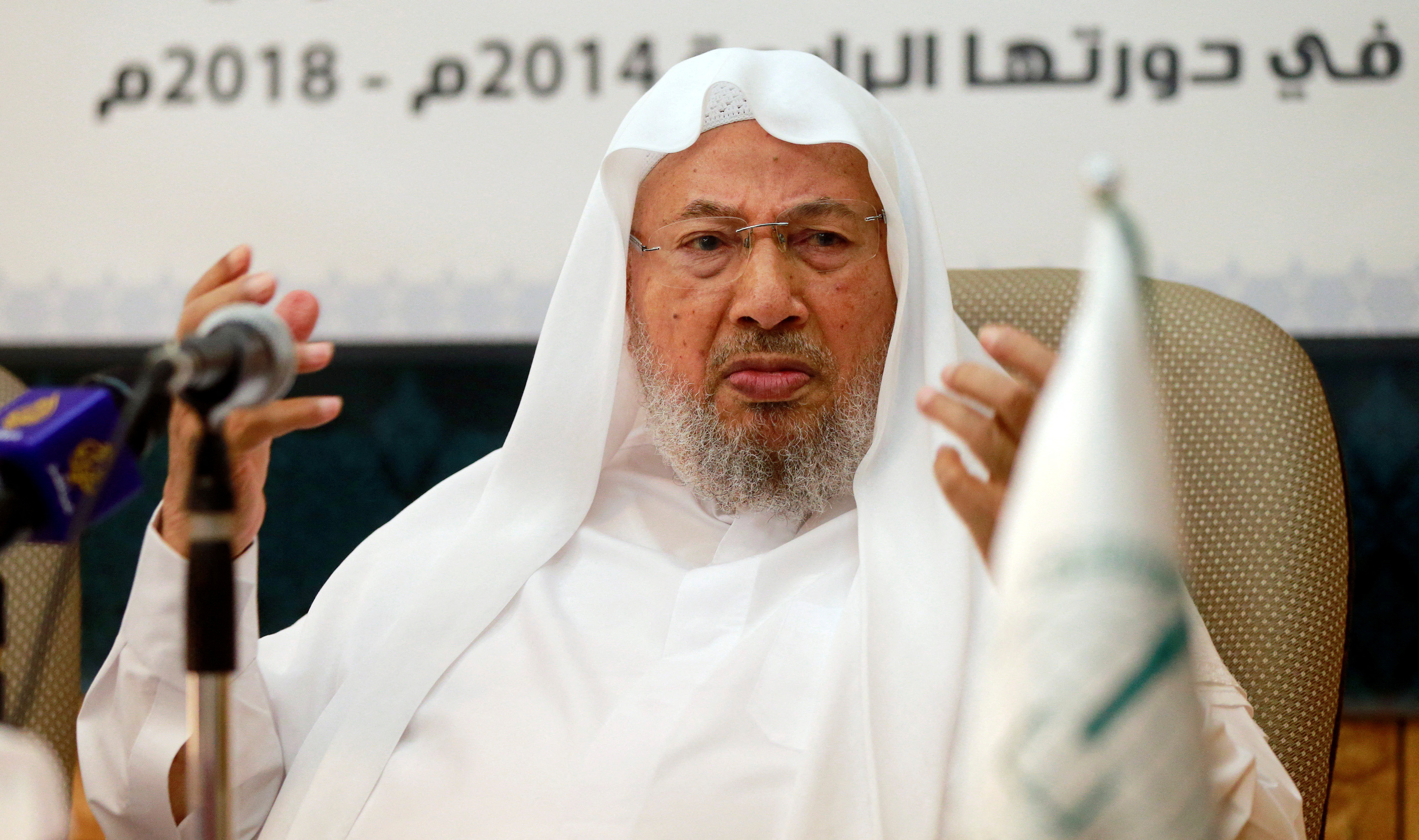 Chairman of the International Union of Muslim Scholars Youssef al-Qaradawi speaks during a news conference in Doha