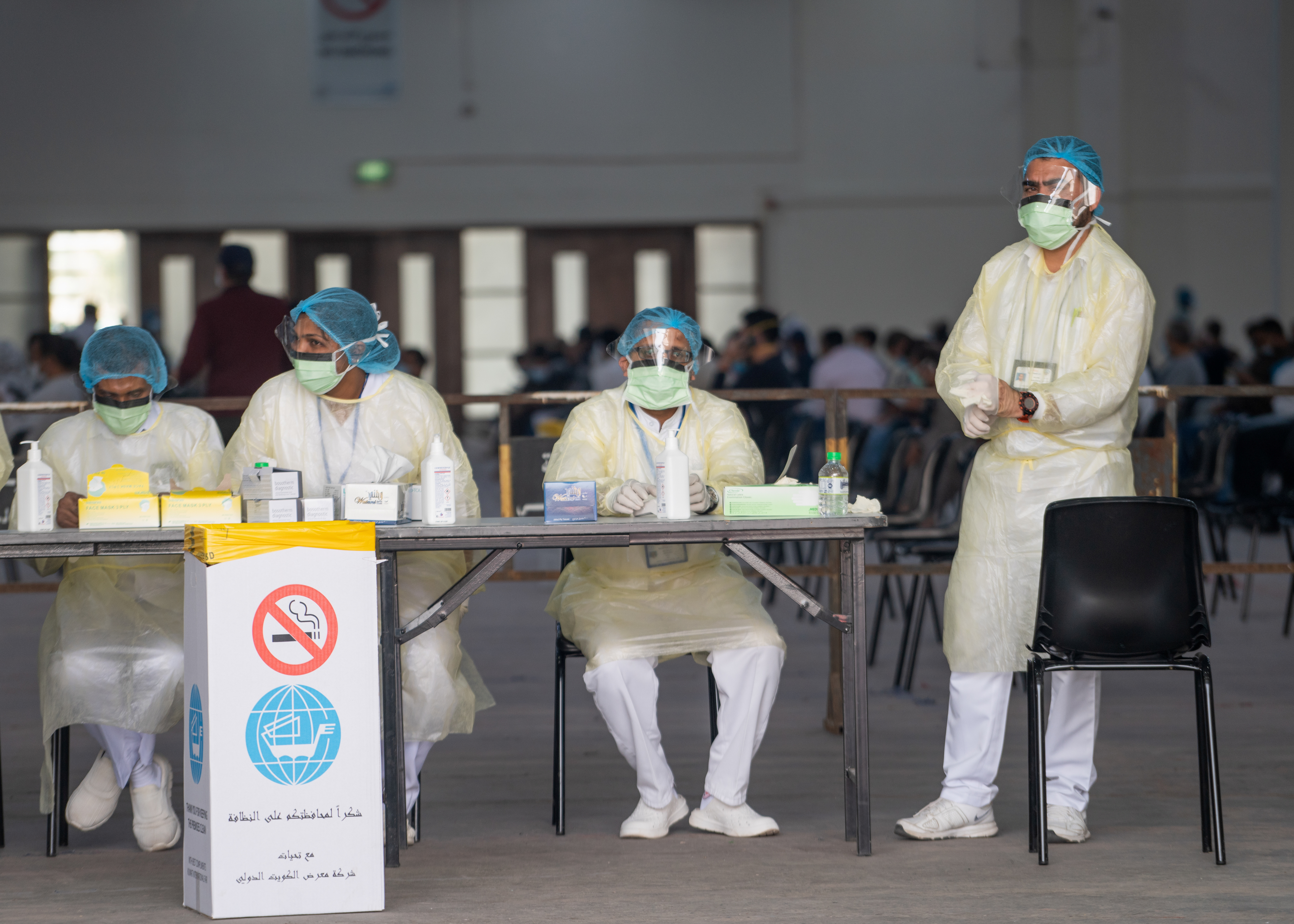 Nurses await to admit expatriates in a makeshift coronavirus testing centre at the Mishref Fair Grounds in Kuwait city, Kuwait March 12, 2020. REUTERS/Stephanie McGehee
