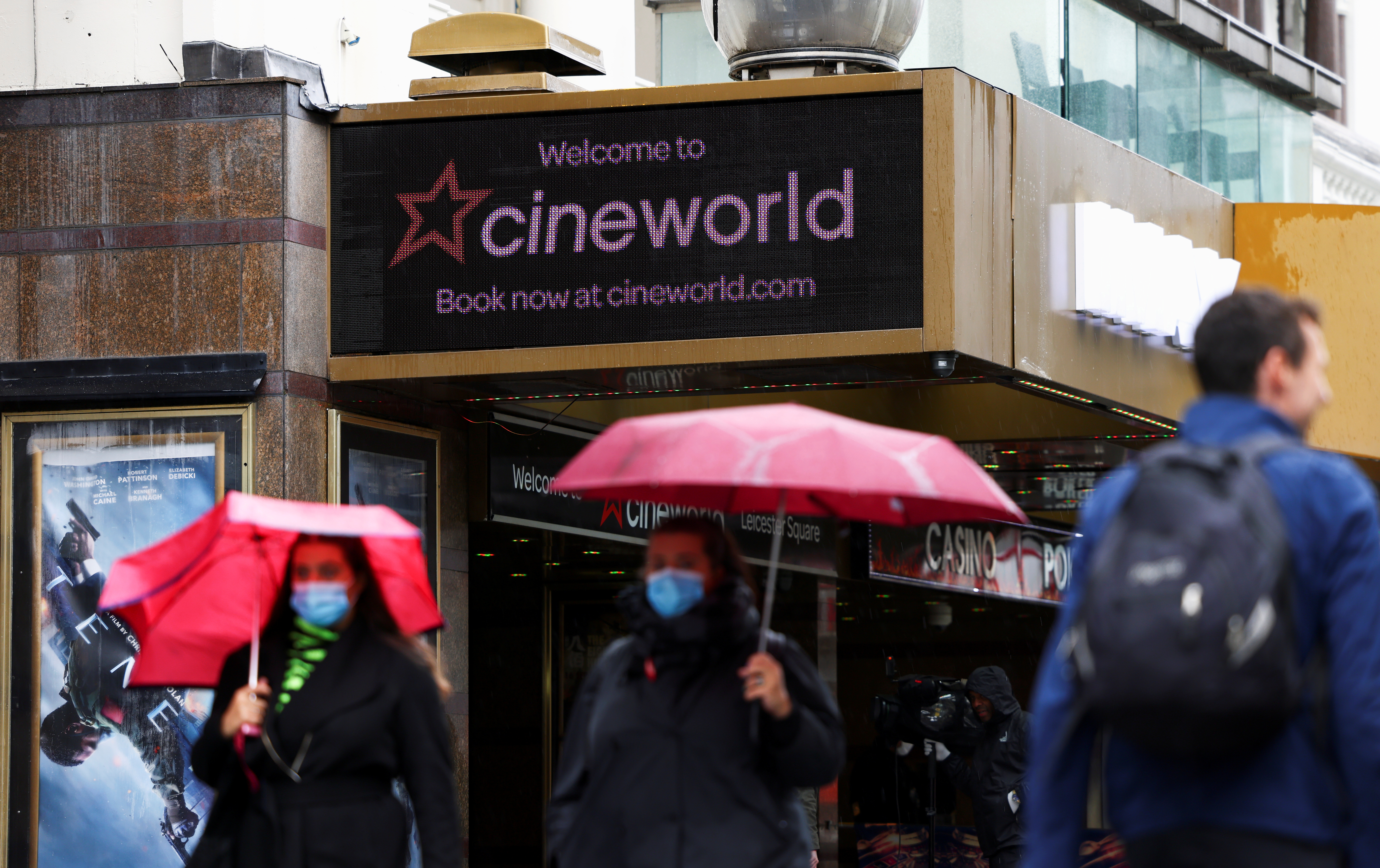 People walk past a Cineworld in Leicester's Square, amid the coronavirus disease (COVID-19) outbreak in London, Britain, October 4, 2020. REUTERS/Henry Nicholls/File Photo