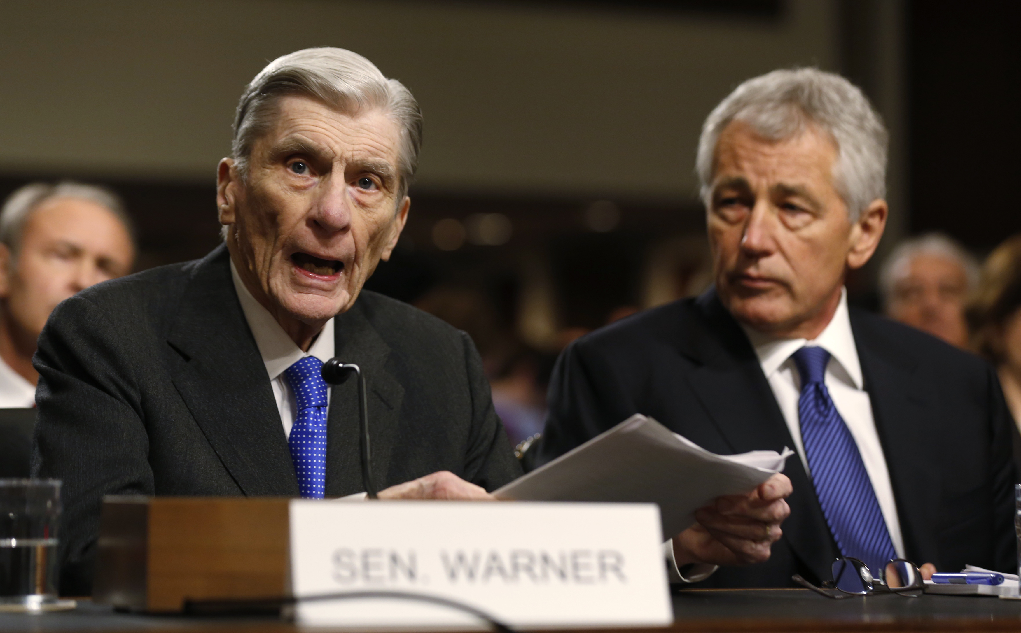 Former U.S. Senator Warner introduces former U.S. Senator Hagel during Senate Armed Services Committee hearing on his nomination to be Defense Secretary, on Capitol Hill in Washington