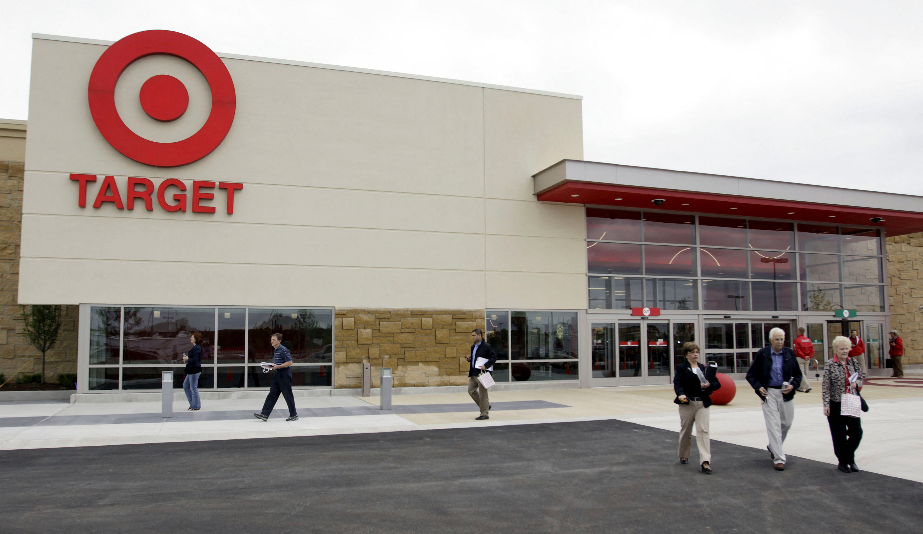 Target Corporation shareholders leave the annual shareholders meeting following a vote to keep the current Target board members at a new Target store in Waukesha