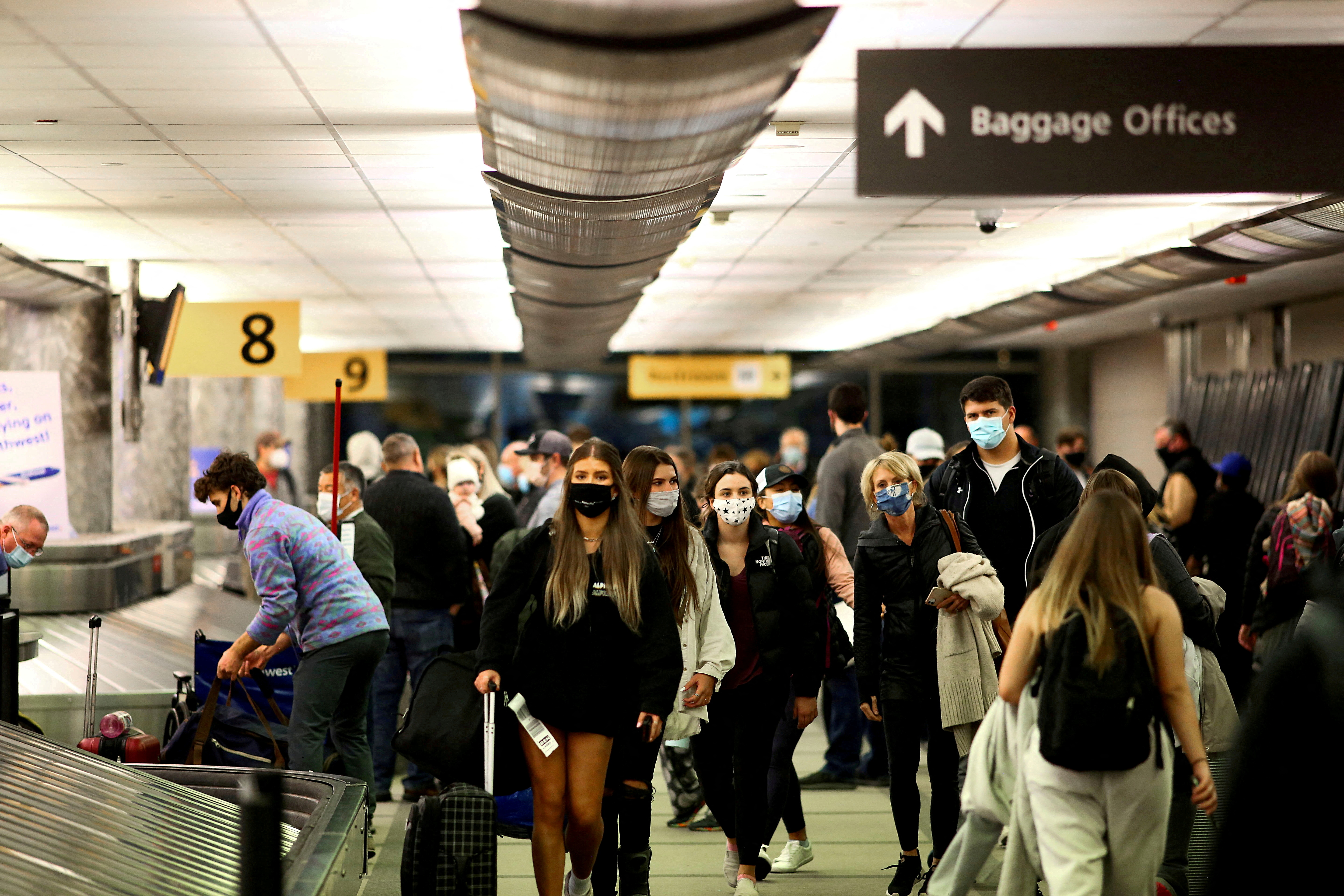 Travelers reclaim luggage at Denver airport