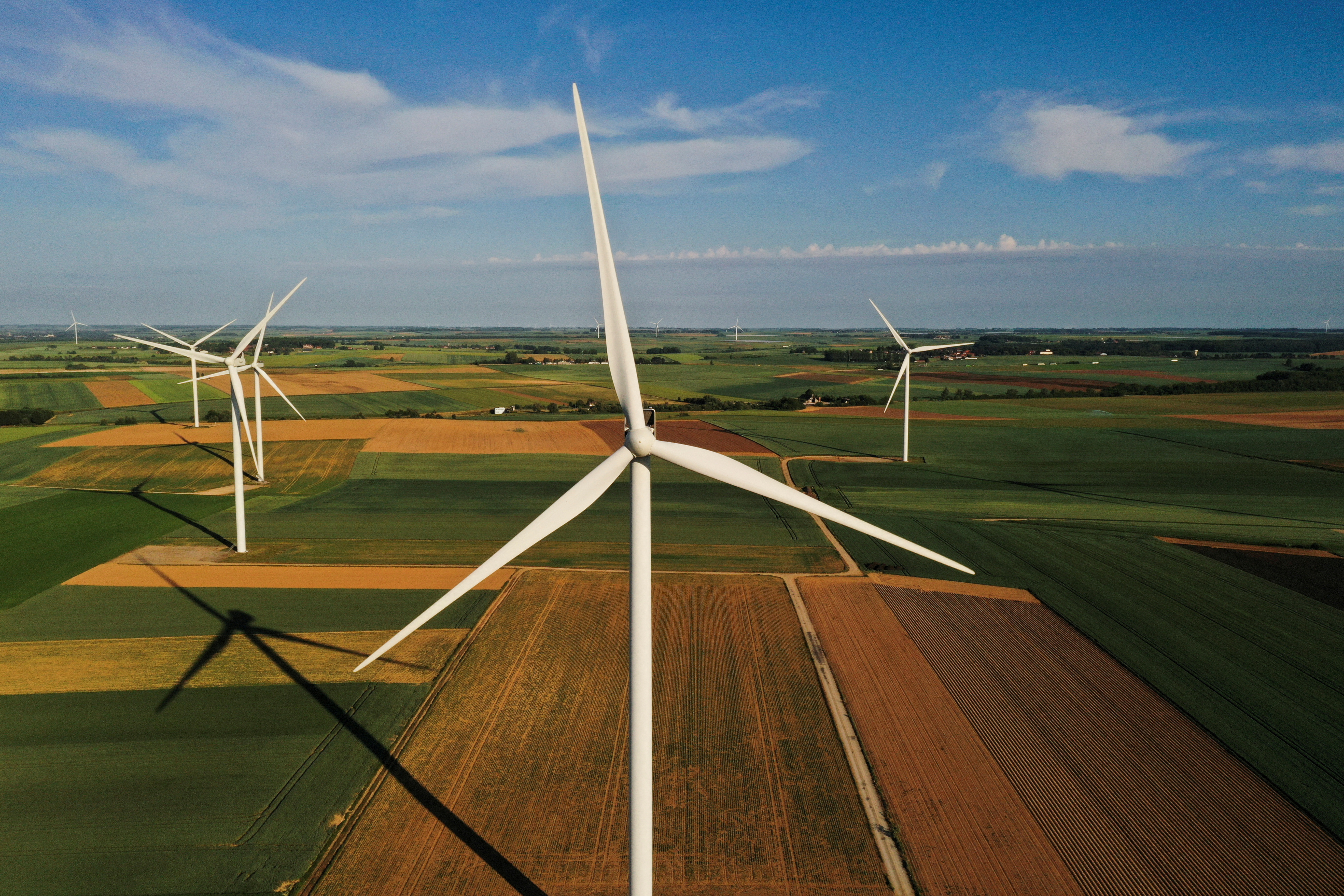 An aerial view shows power-generating windmill turbines in a wind farm in Graincourt-les-havrincourt