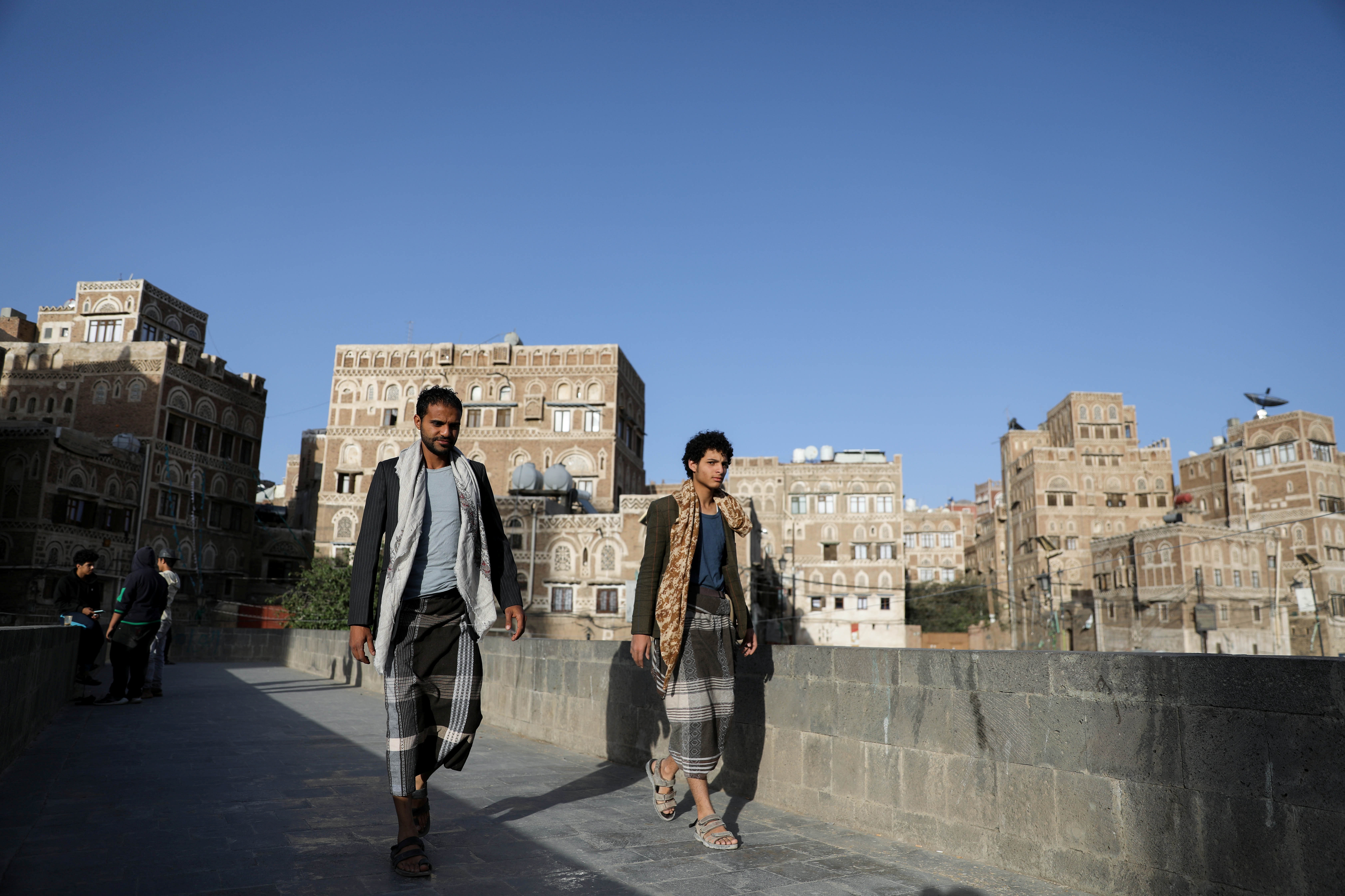 People walk in the old quarter of Sanaa