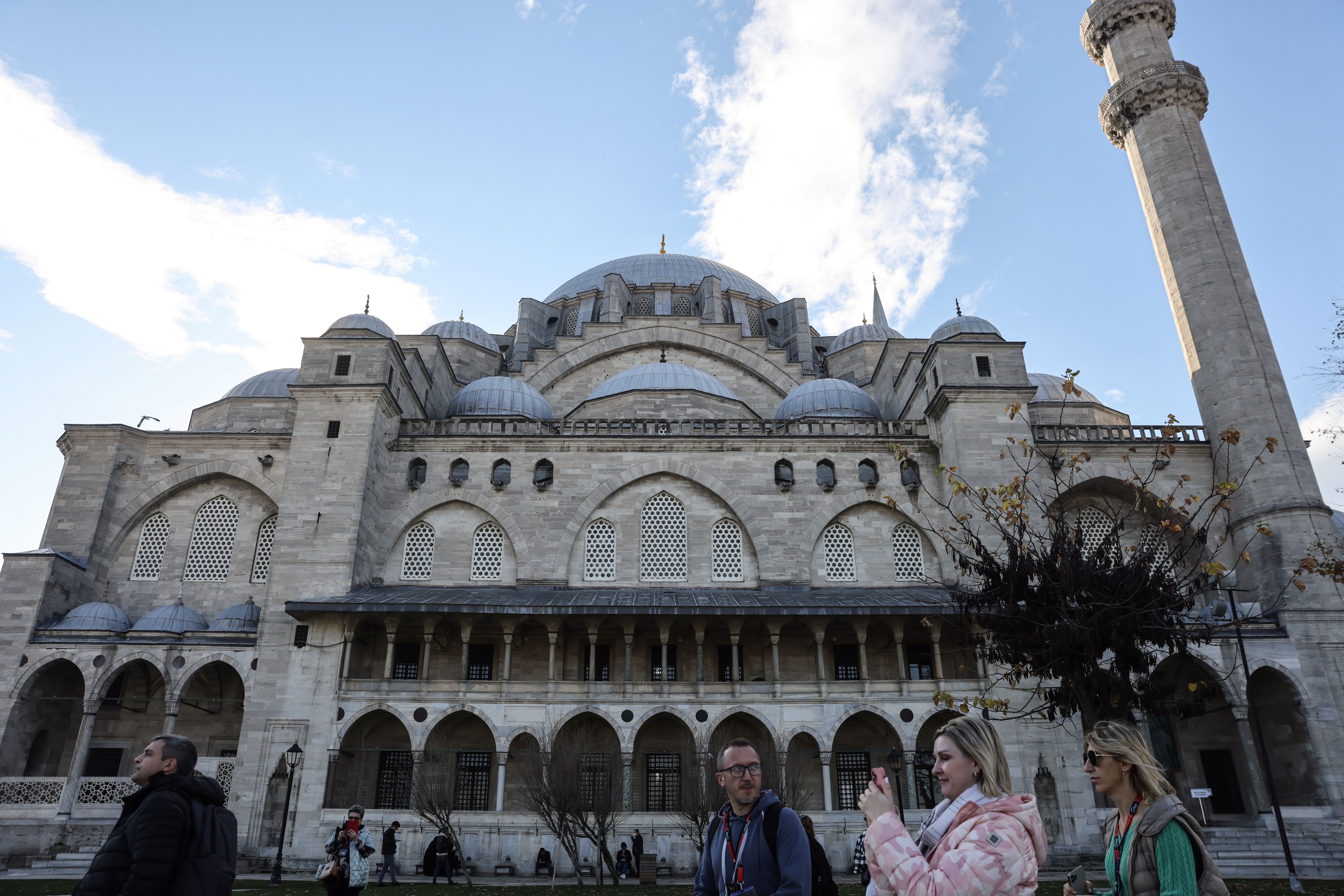 Tourists visit Suleymaniye Mosque in Istanbul