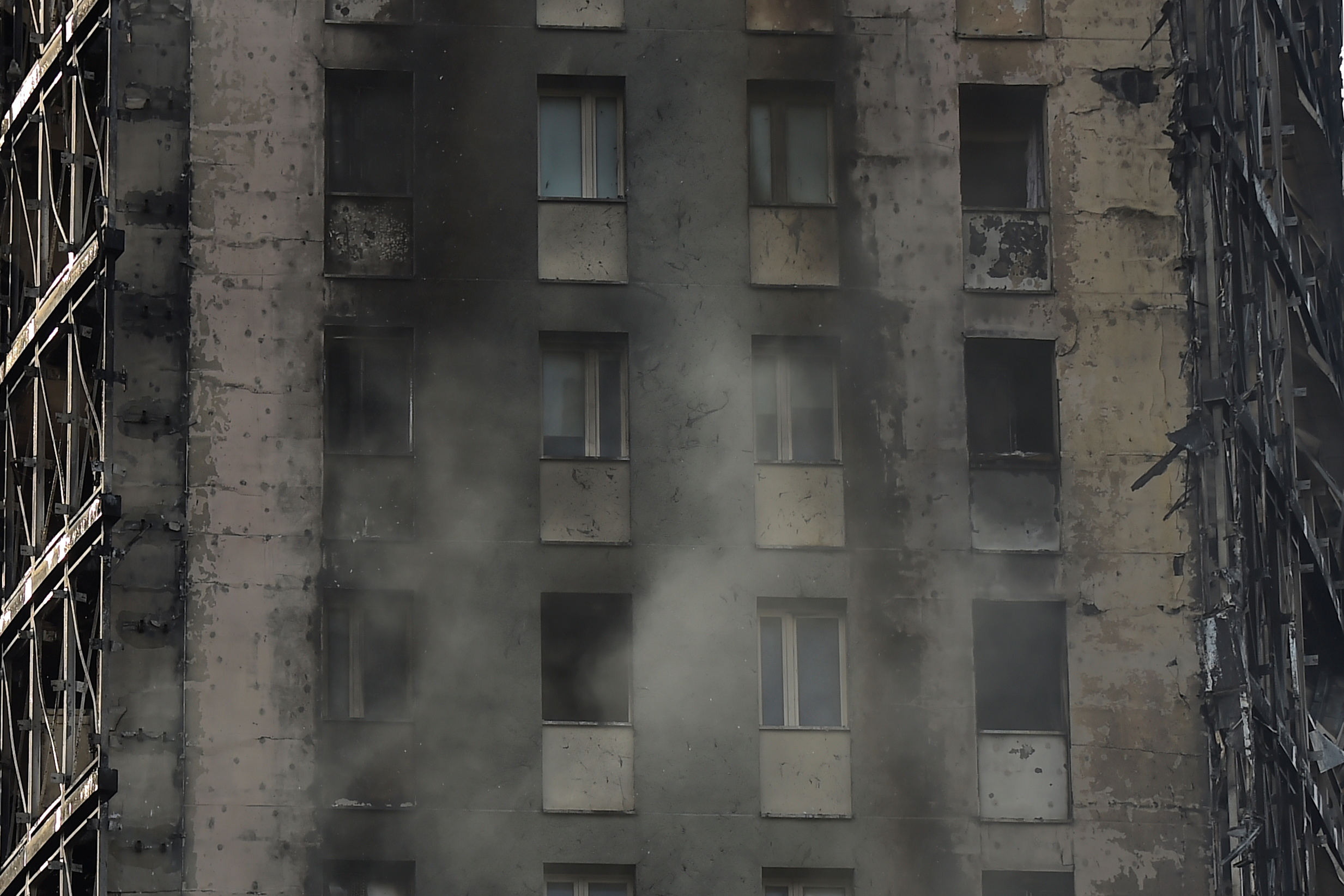 Blackened ruins of a block of flats are seen after a fire ripped through the building, no injuries were reported, in Milan, Italy, August 30, 2021. REUTERS/Flavio Lo Scalzo