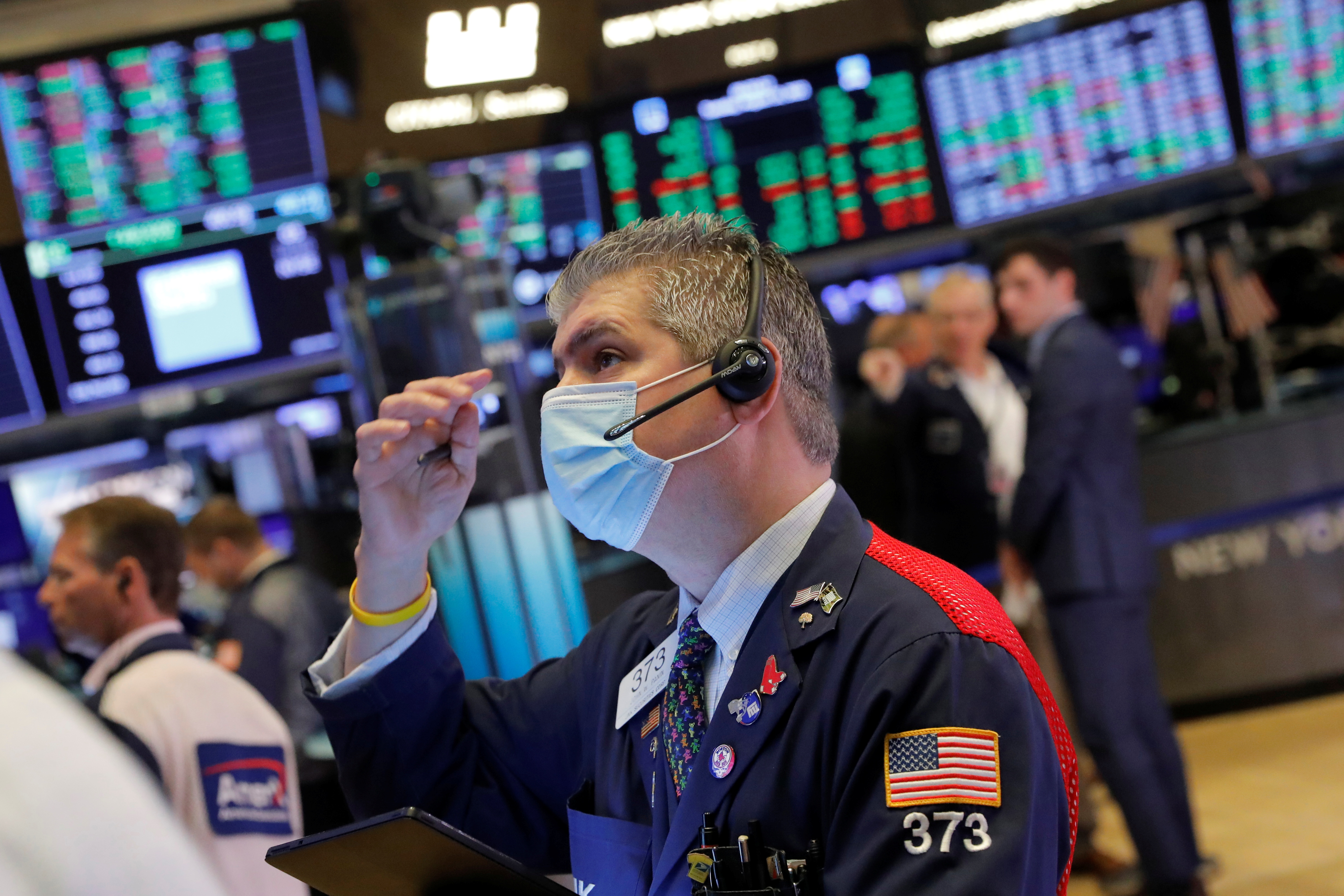 A trader works on the trading floor at the New York Stock Exchange (NYSE) in Manhattan, New York City