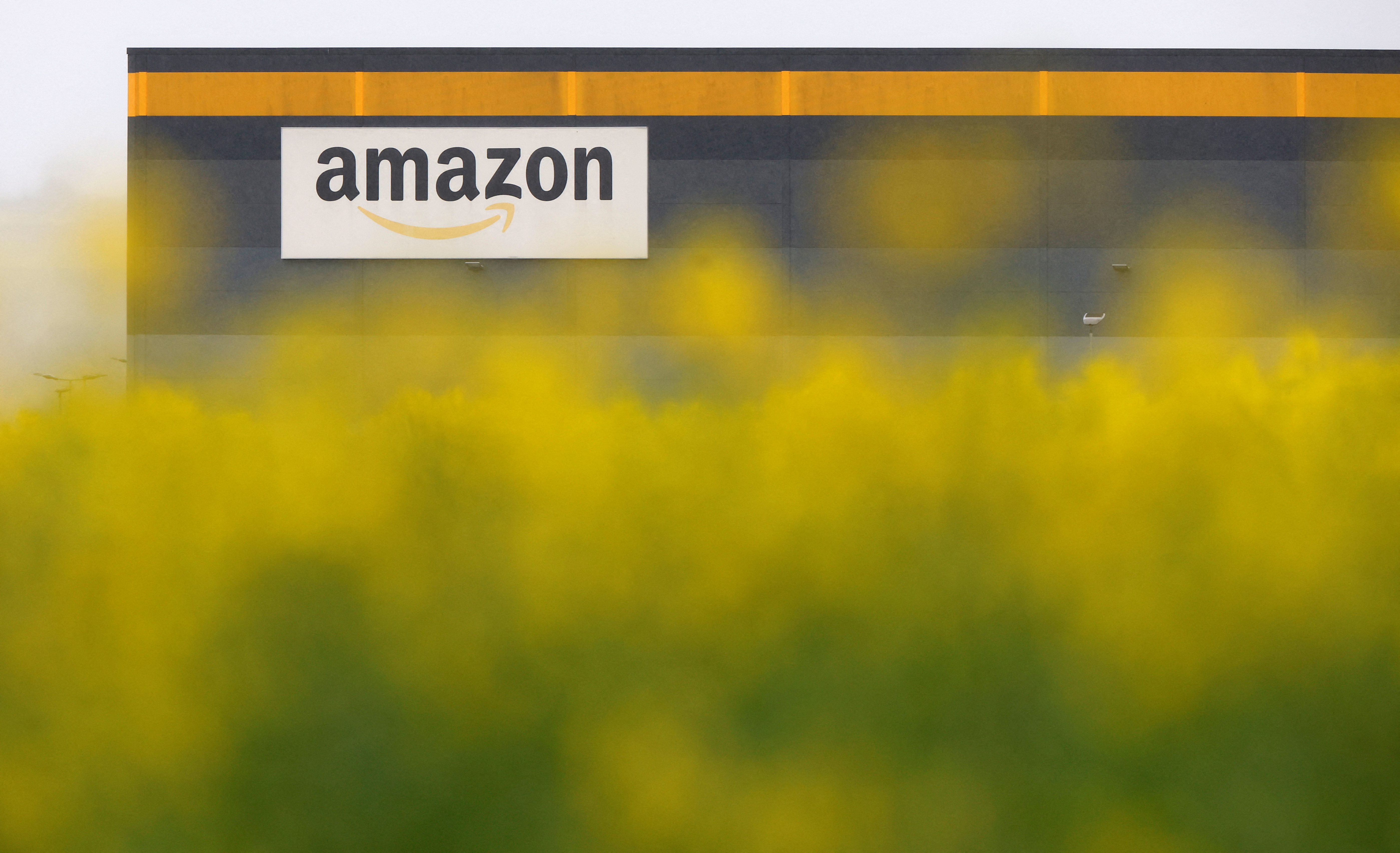 A logo of Amazon is seen on a company's logistics centre