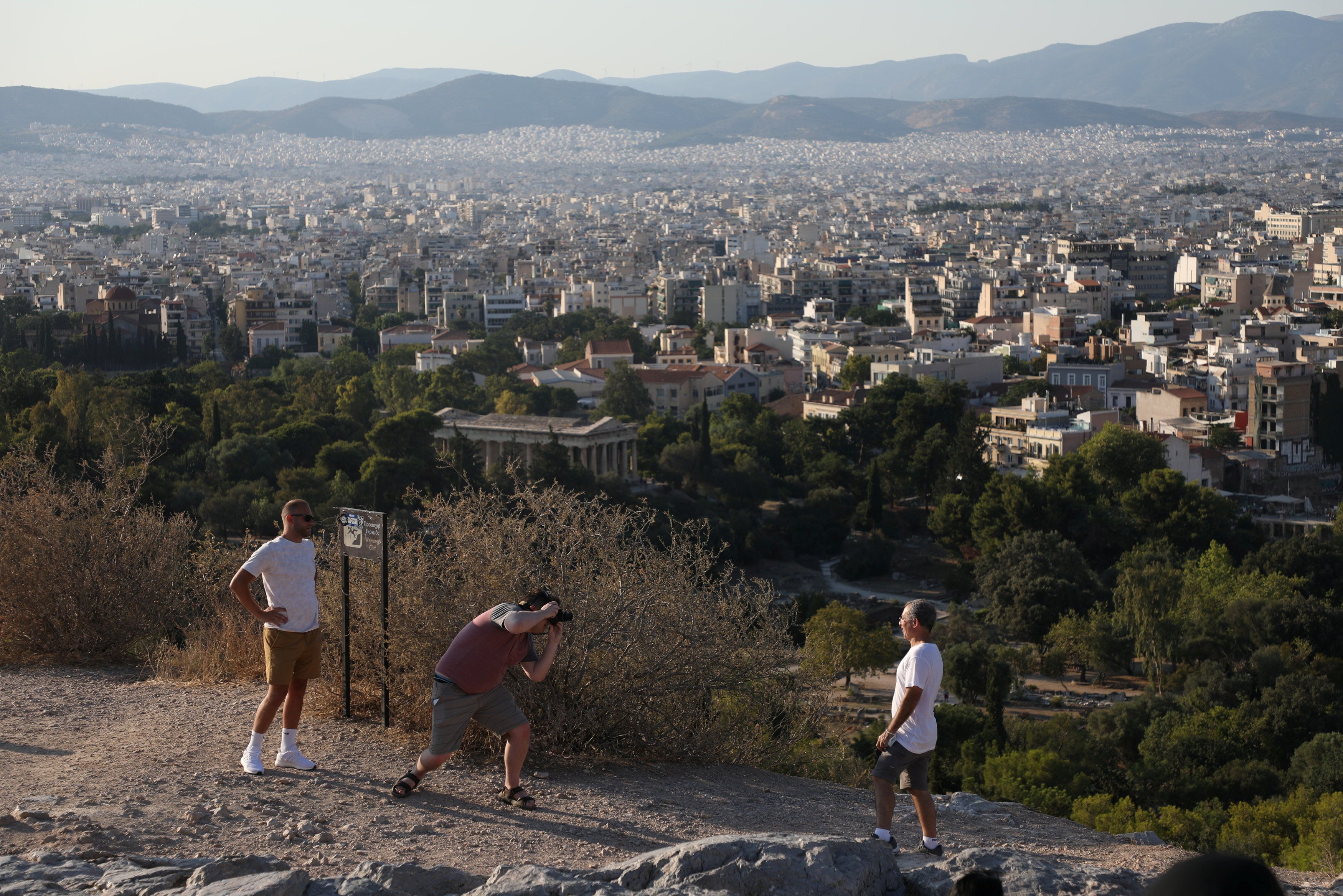 People visit the Areios Pagos hill in Athens