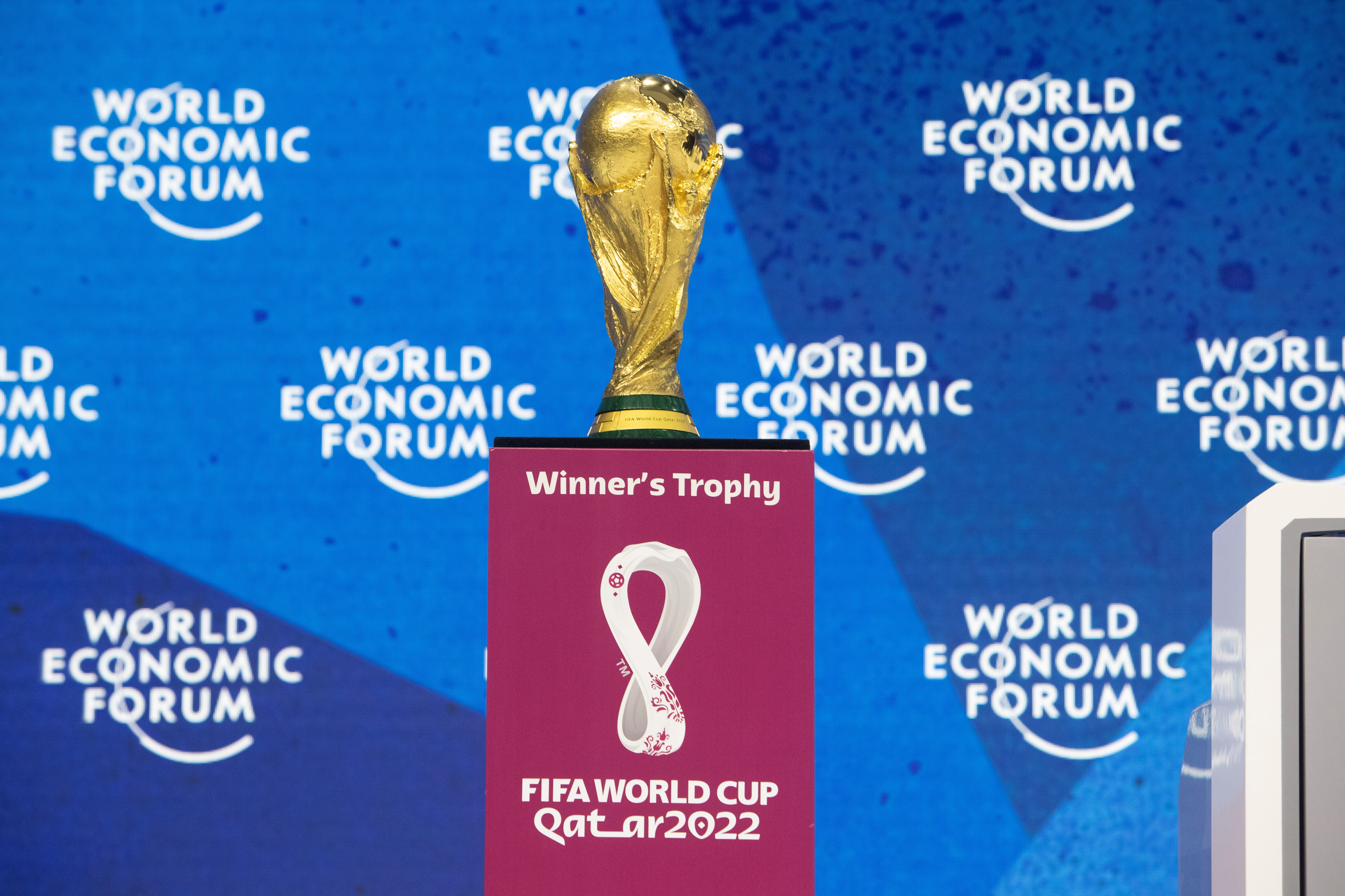 FIFA World Cup trophy is displayed during a panel discussion in Davos