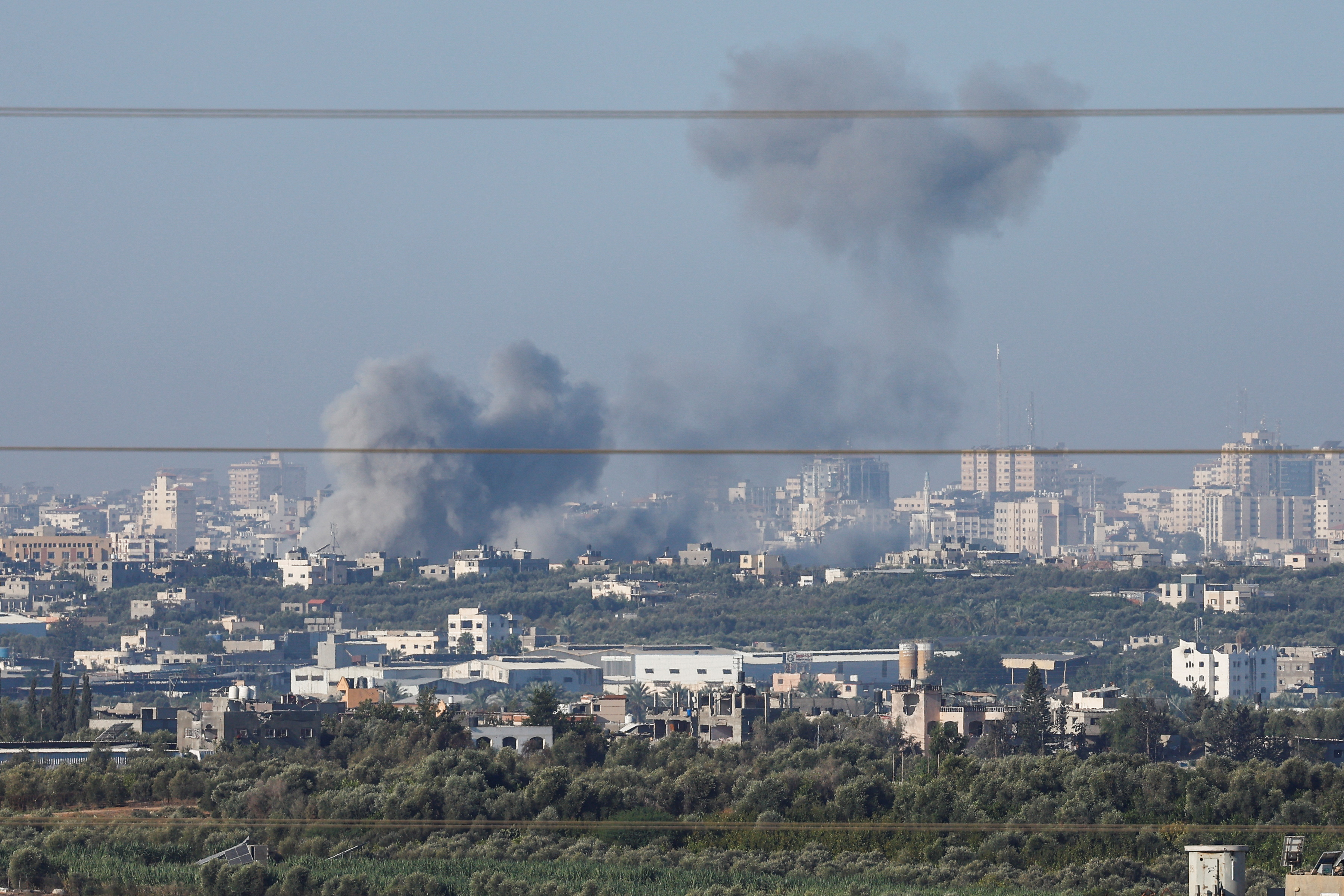 Smoke rises over Gaza, as seen from Israel's border with Gaza, in southern Israel
