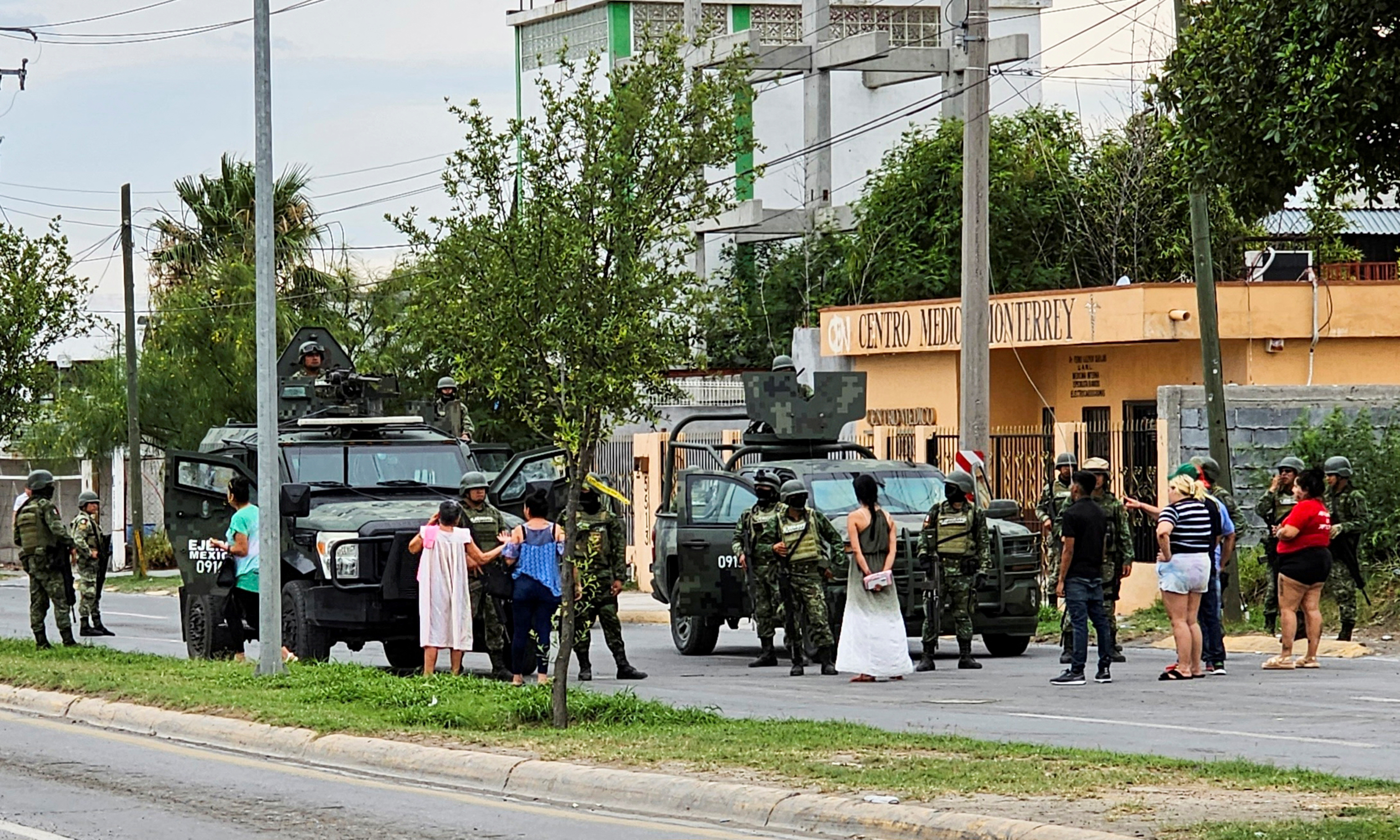 Soldiers guard a crime scene where five men were killed following a chase, in Nuevo Laredo