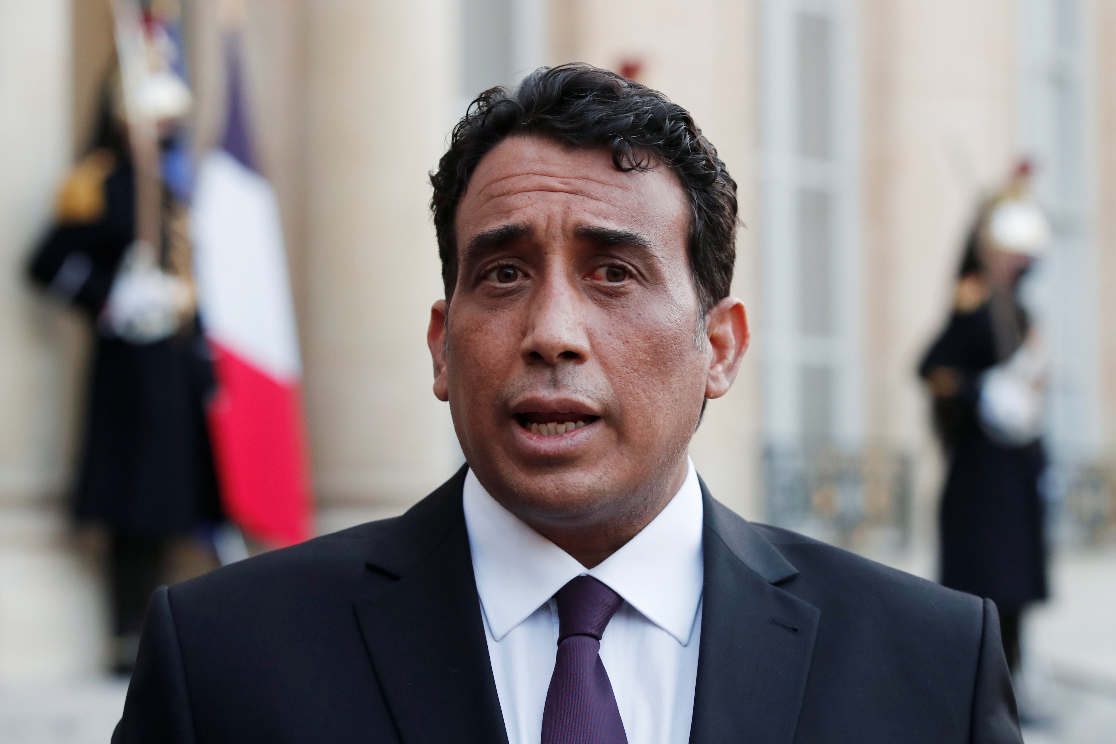 Mohamed al-Menfi, Head of the Presidential Council of Libya, talks to the press after a meeting with the French President at the Elysee Palace in Paris