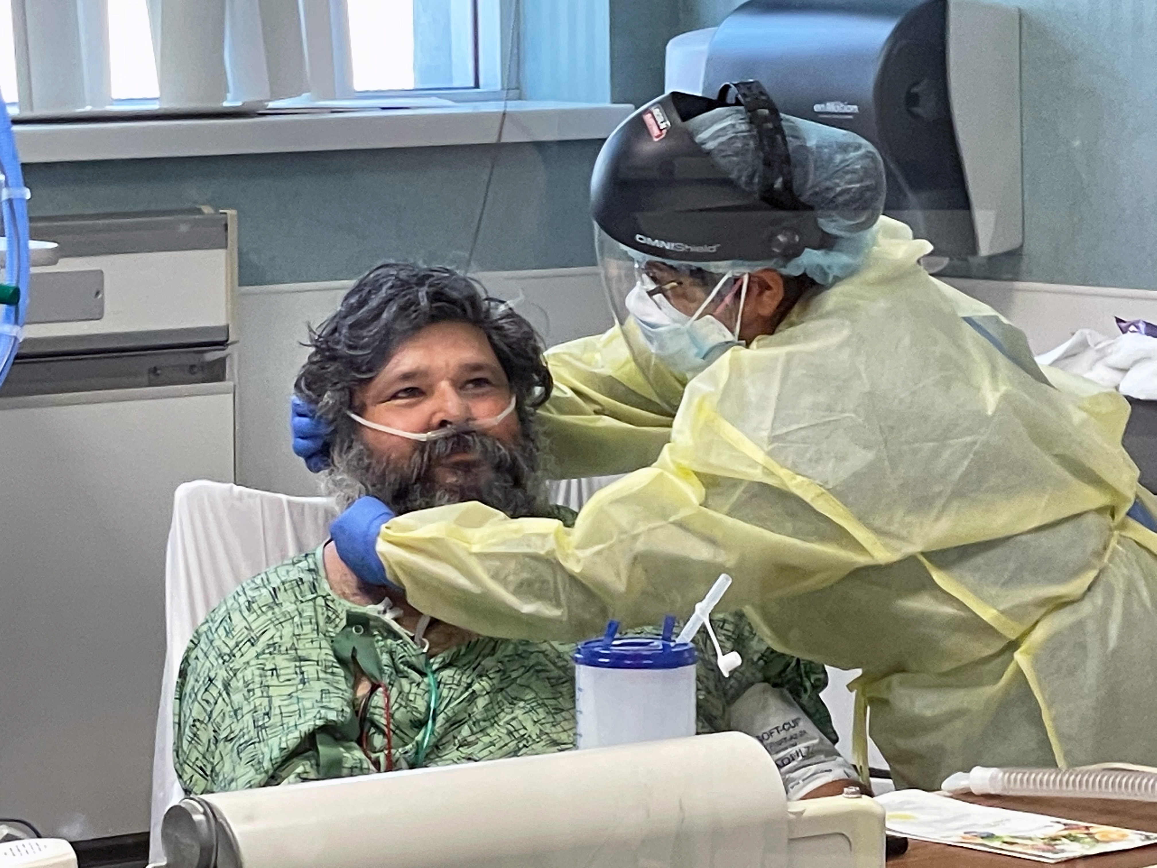 A COVID-19 patient is treated in the ICU at Providence St Joseph Hospital in Orange, California