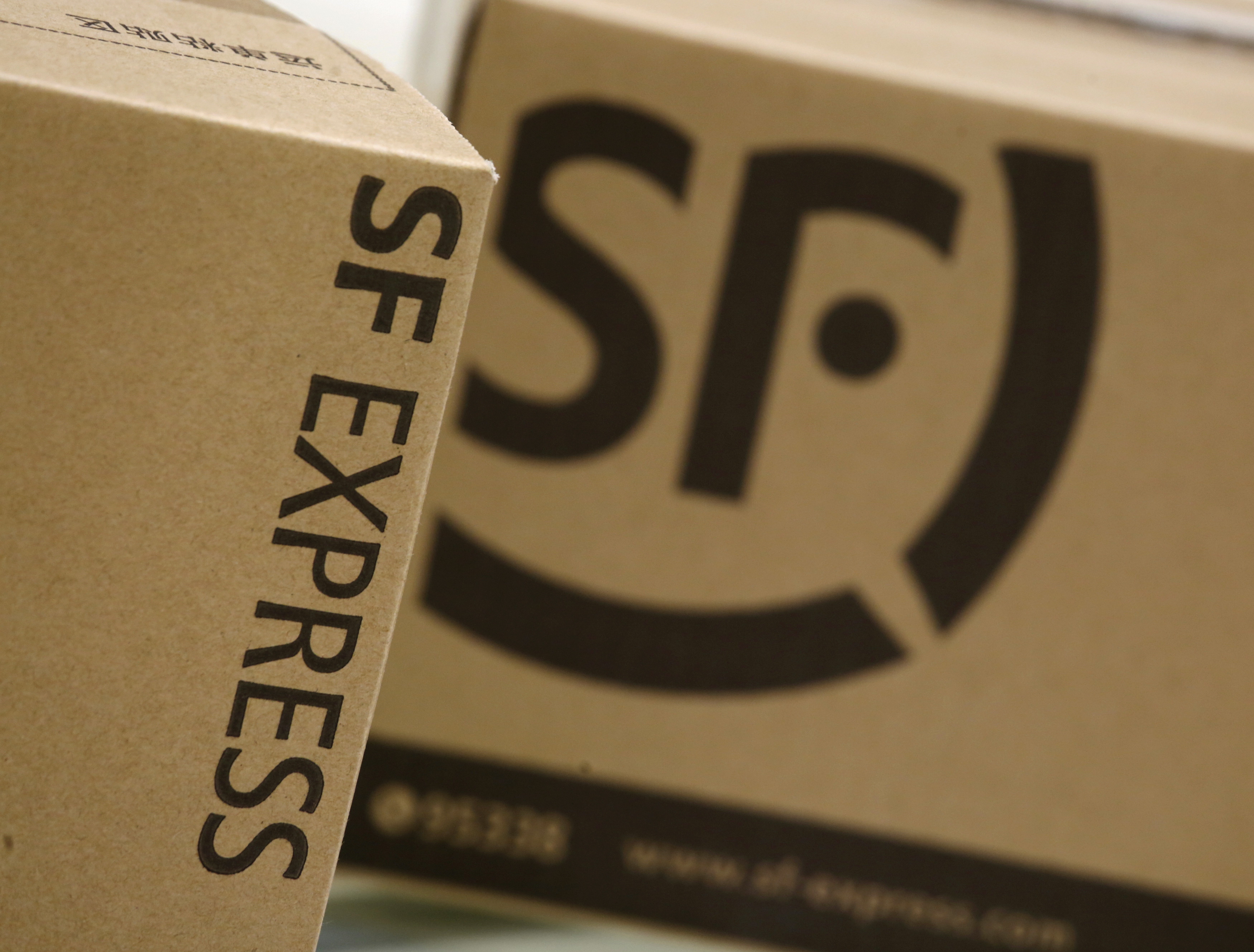SF Express courier boxes are displayed in this illustration photo at the company's headquarters in Shenzhen