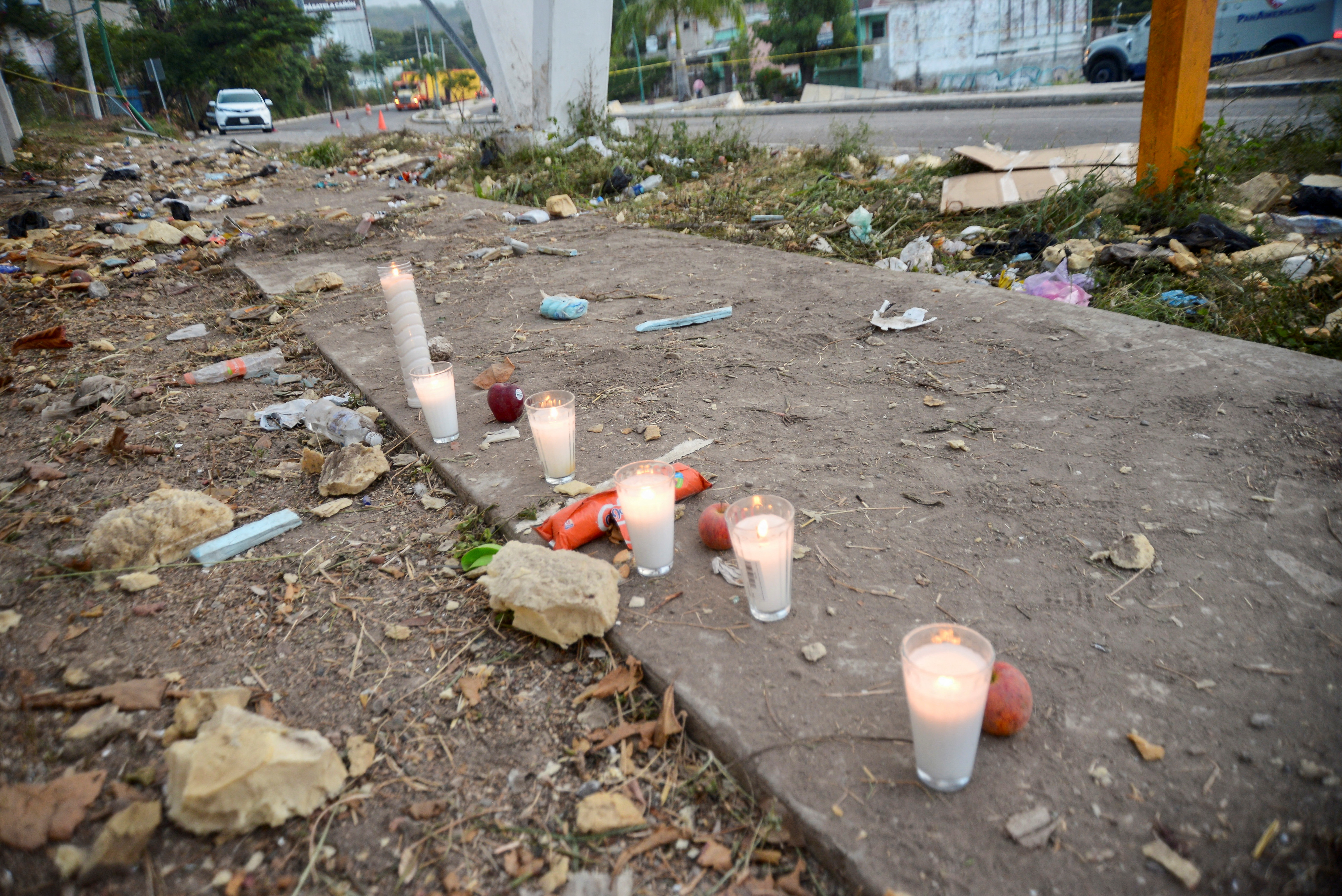 Votive candles are pictured at the site of a truck accident in Tuxtla Gutierrez