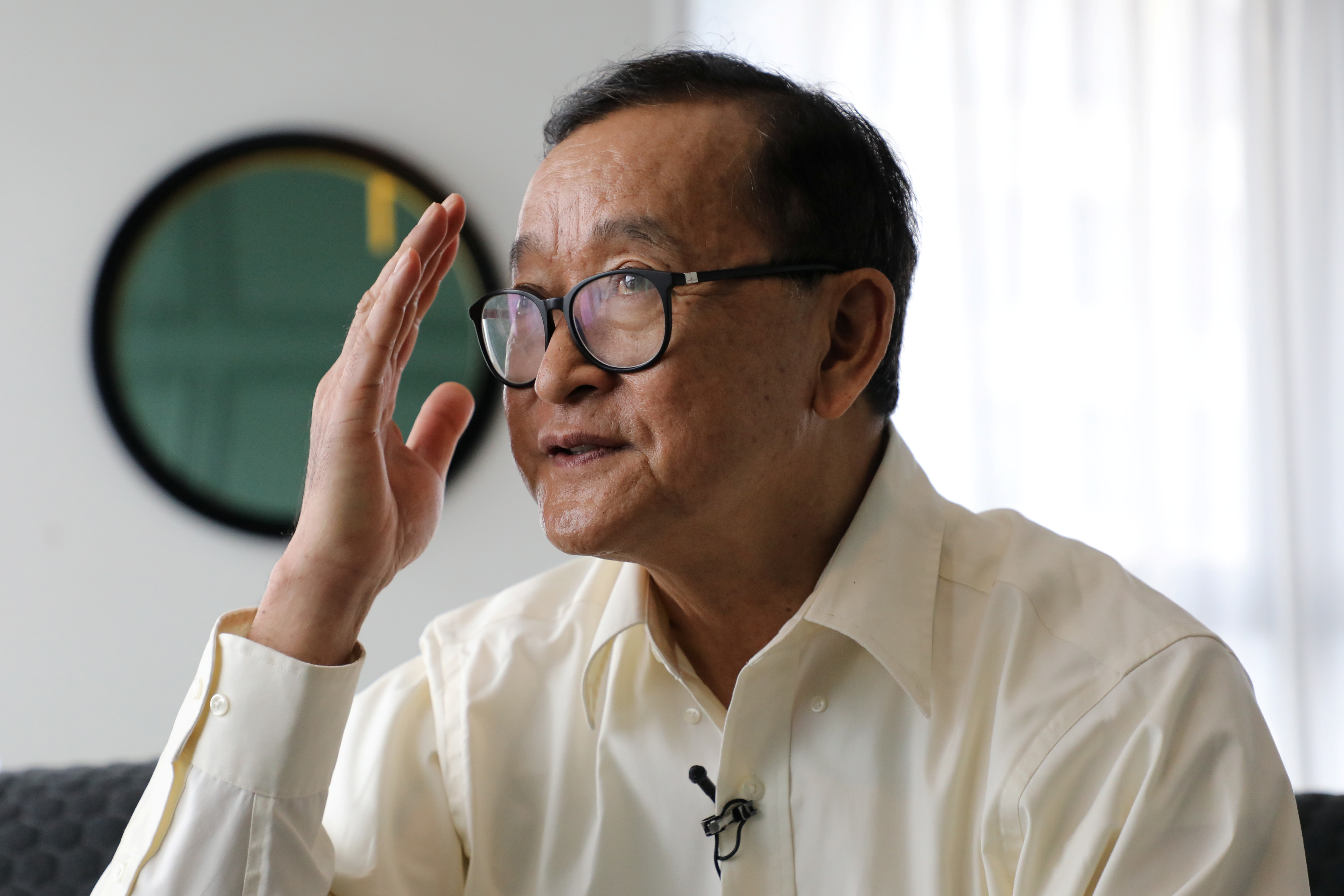 Self-exiled Cambodian opposition party founder Sam Rainsy speaks during an interview with Reuters at a hotel in Kuala Lumpur