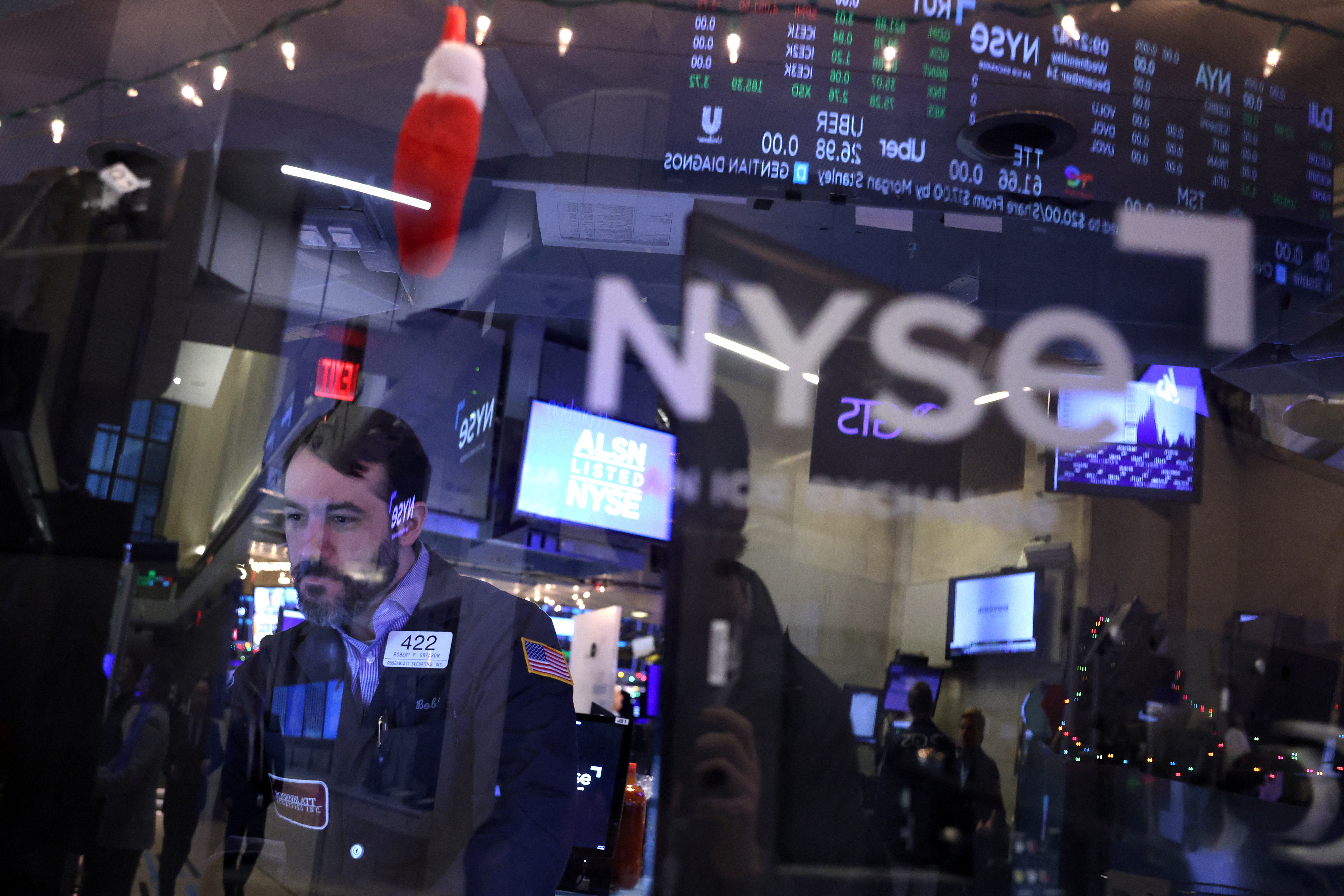 A trader works on the trading floor of the New York Stock Exchange (NYSE) in New York City