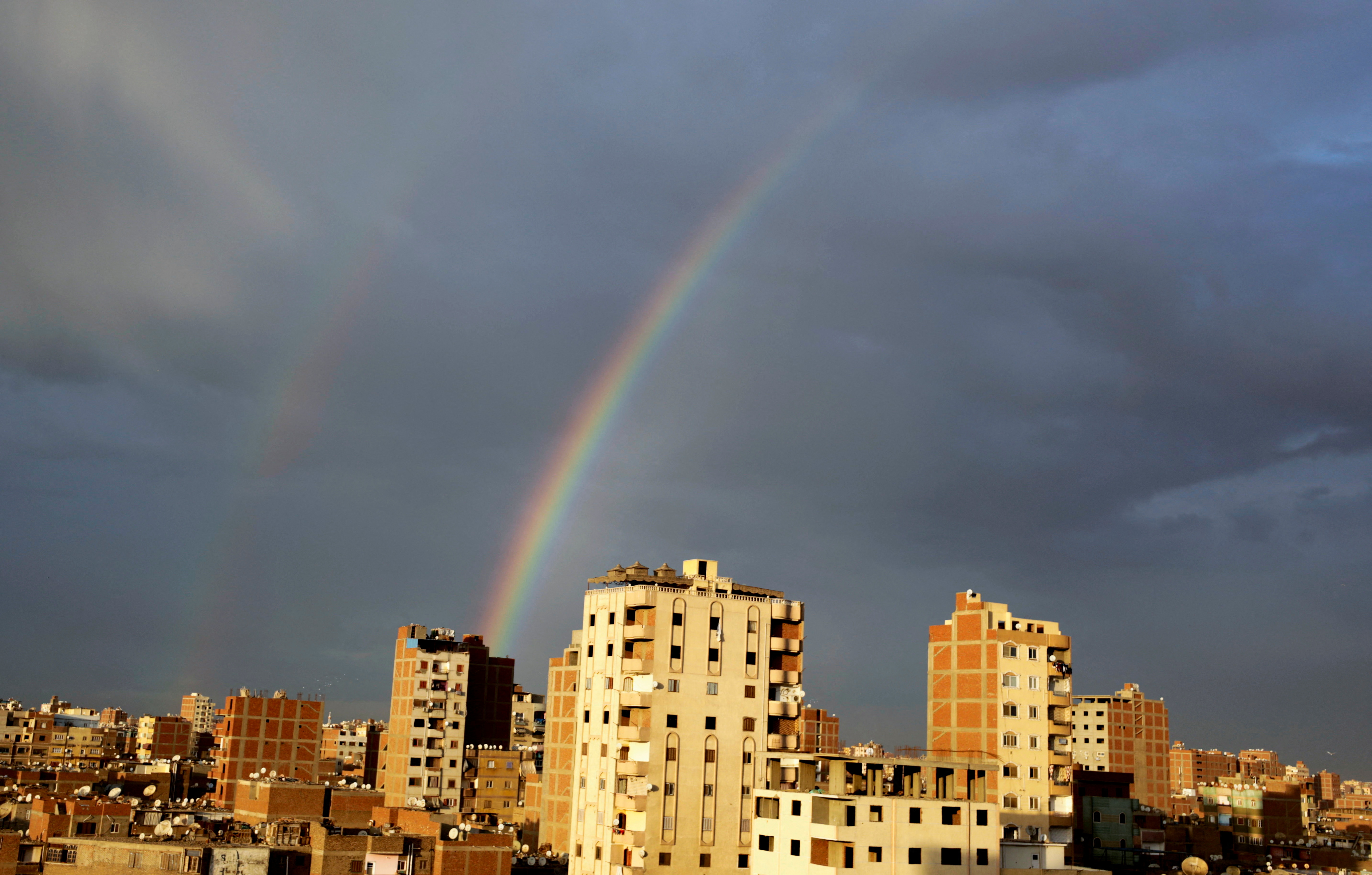 Rainbow is seen in the sky in Cairo