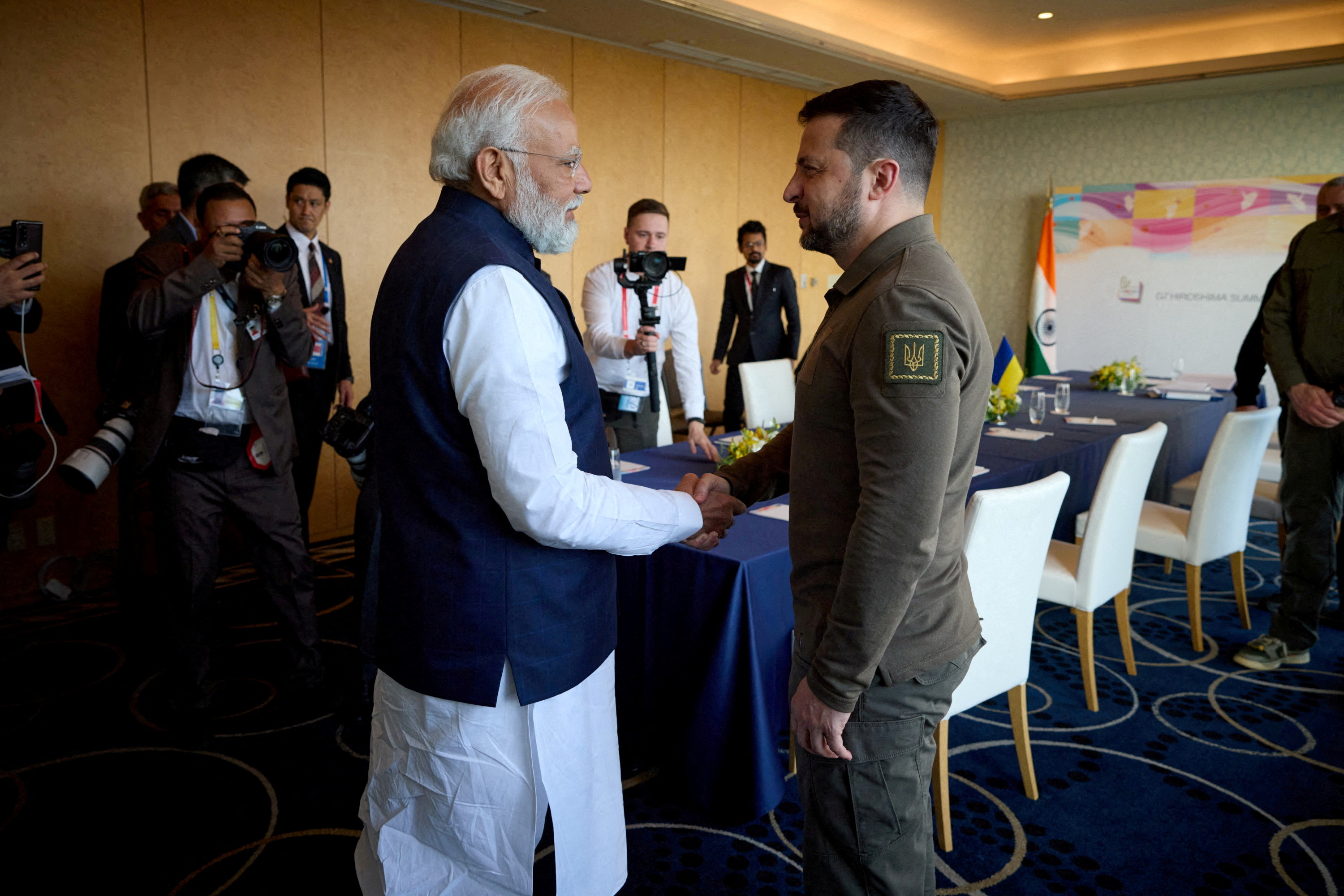 Ukrainian President Volodymyr Zelenskiy and Indian Prime Minister Narendra Modi shake hands during the G7 leaders' summit in Hiroshima in May 2023