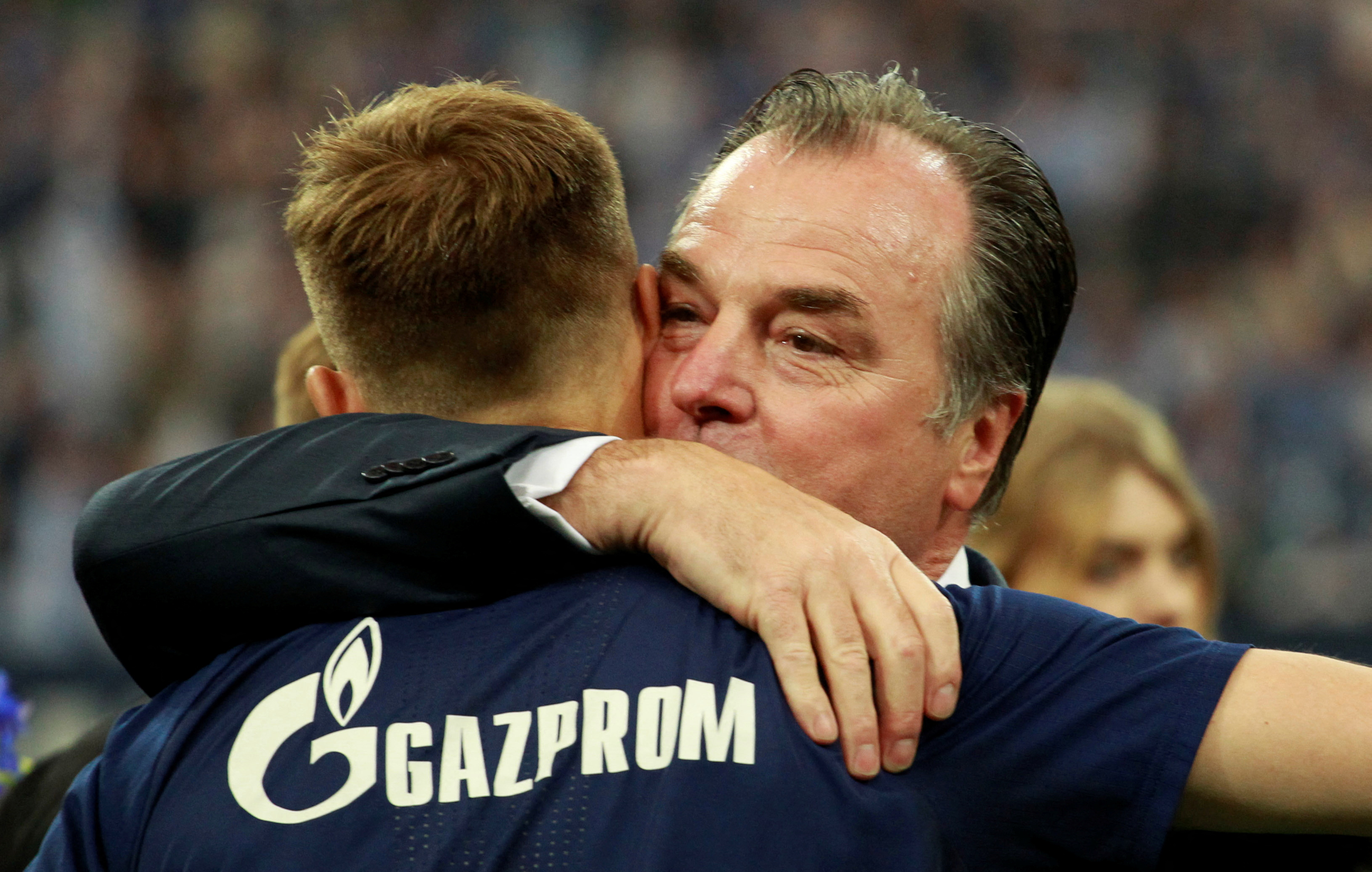 Schalke chairman Clemens Tonnies hugs Holger Badstuber before the match
