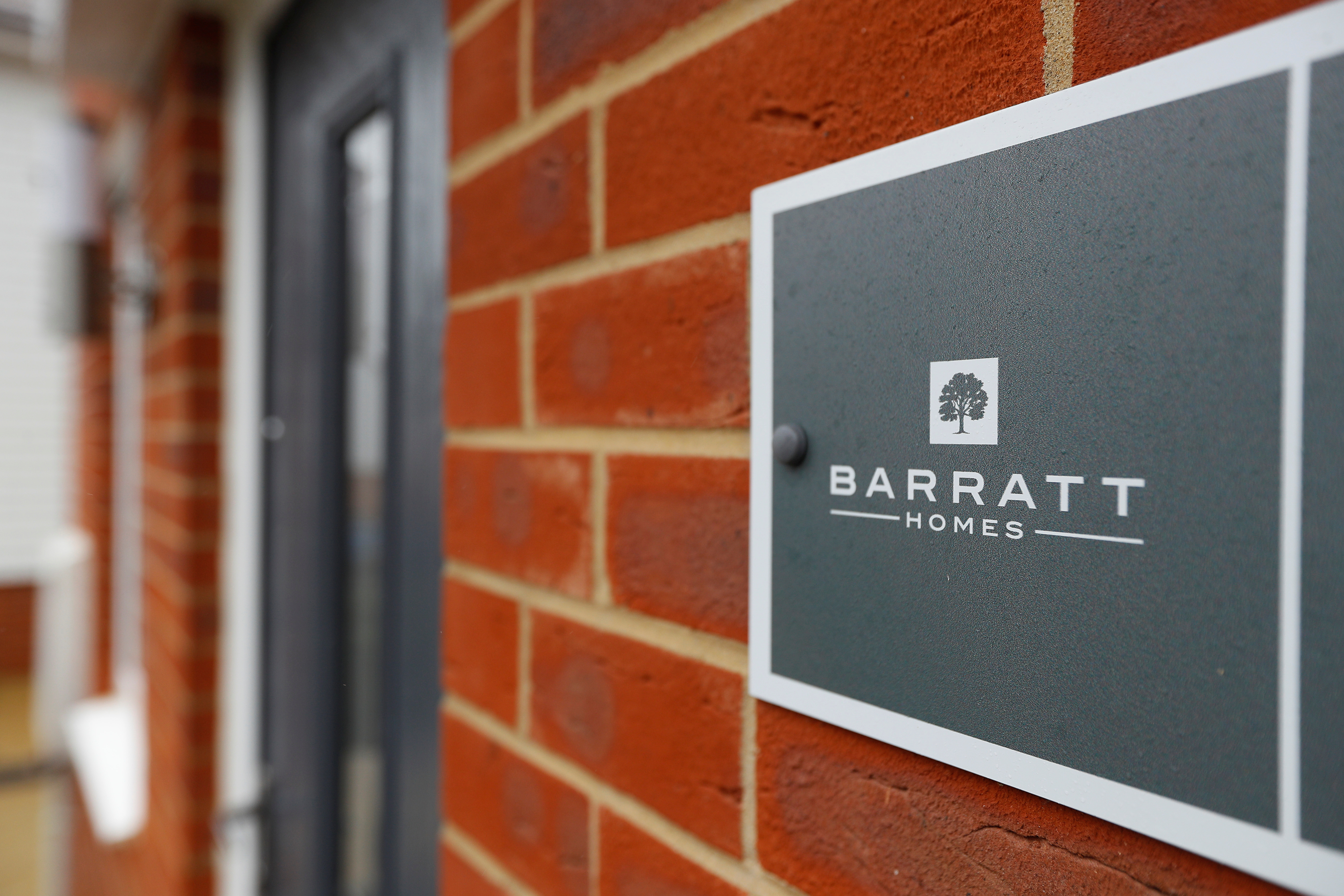 A Barratt homes sign is seen at a Barratt housing development near Haywards Heath, Britain, February 20, 2020. REUTERS/Peter Nicholls/File Photo