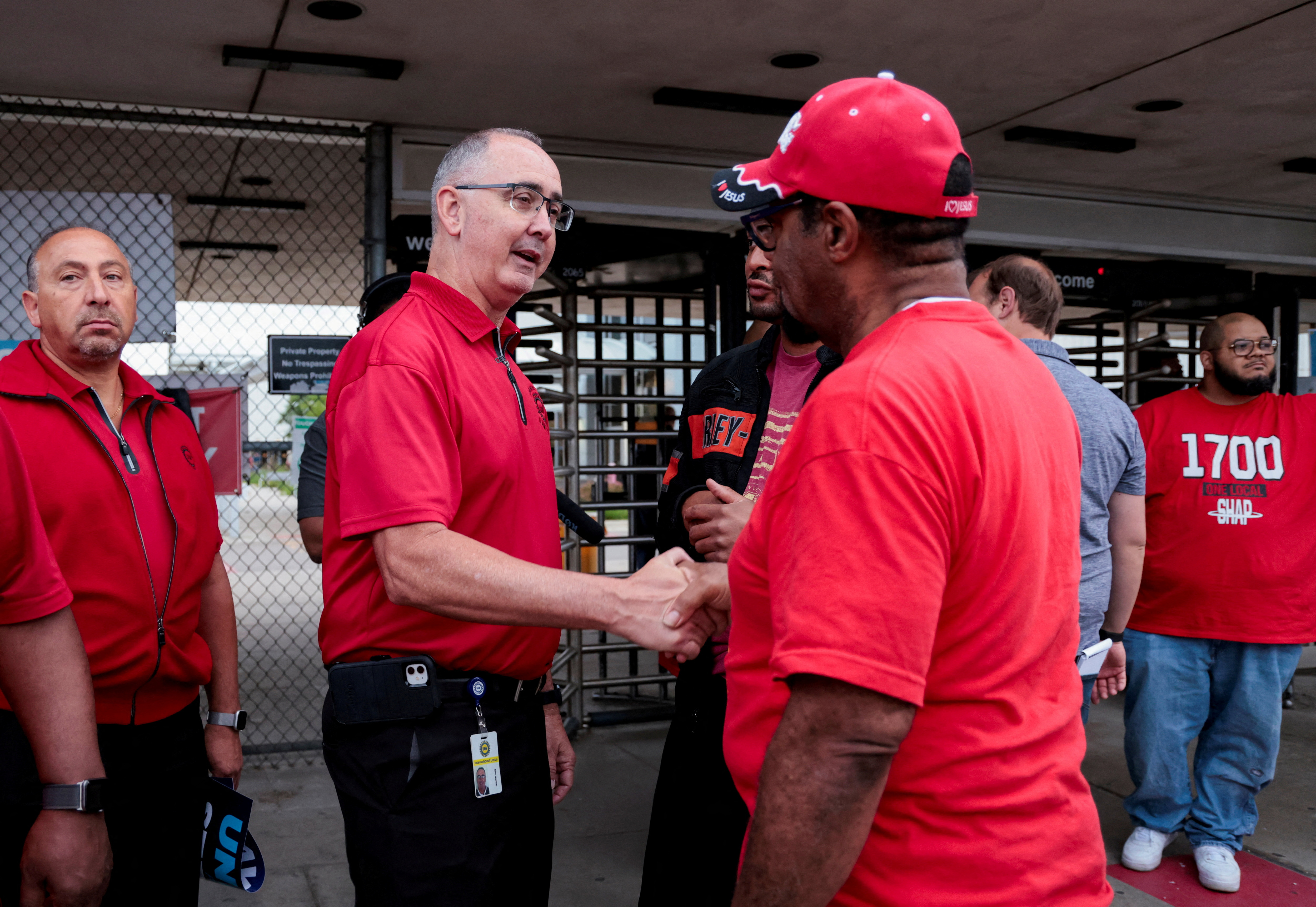 United Auto Workers President Shawn Fain greets UAW autoworkers to mark the beginning of contract negotiations in Sterling Heights