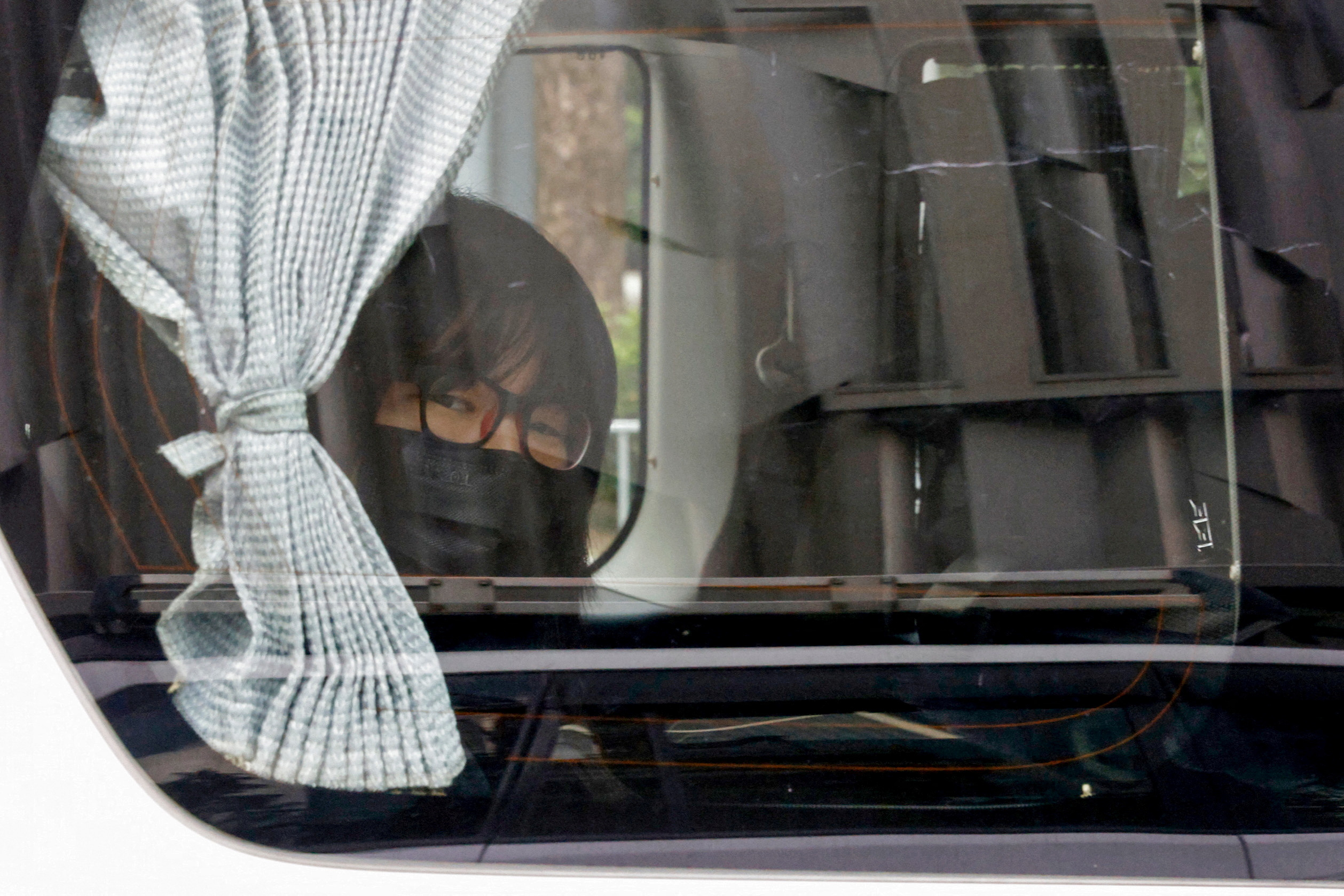 Hong Kong Alliance in Support of Patriotic Democratic Movements of China Vice-Chairwoman Tonyee Chow is seen inside a vehicle after being detained in Hong Kong