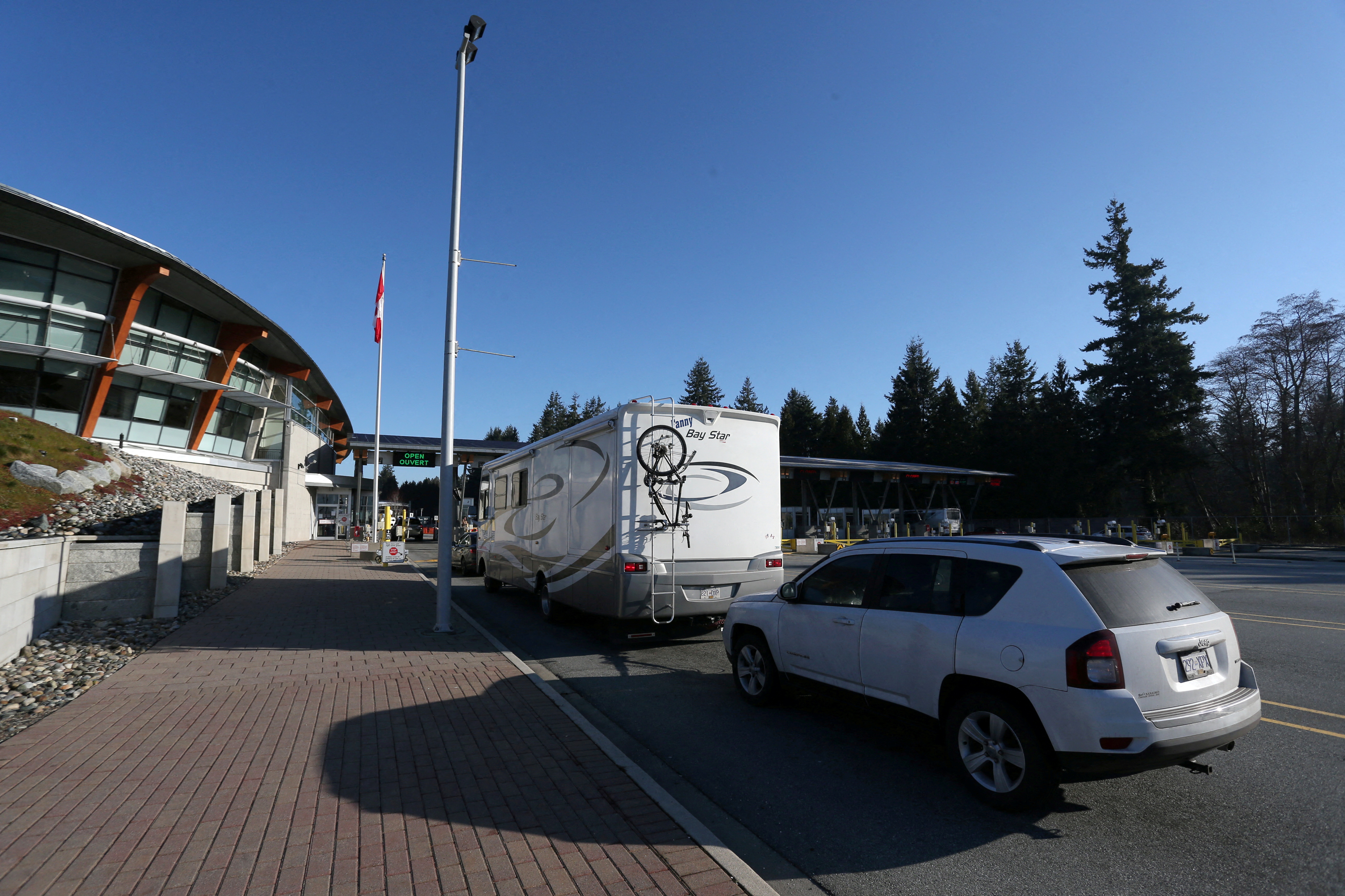 Drivers wait to enter Canadian customs at Canada-US border crossing at Peace Arch park in Surrey