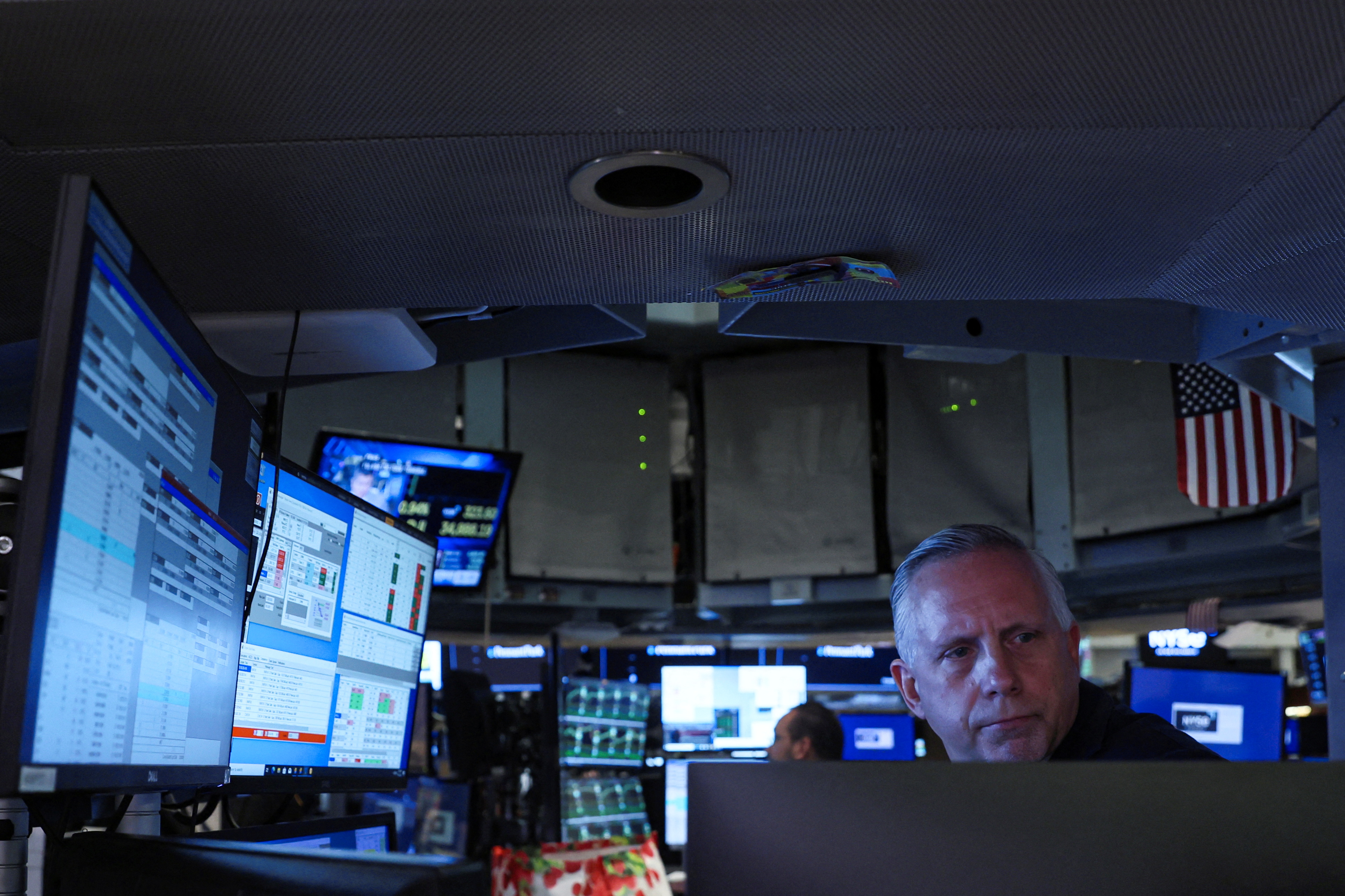 Traders work on the floor of the NYSE in New York City