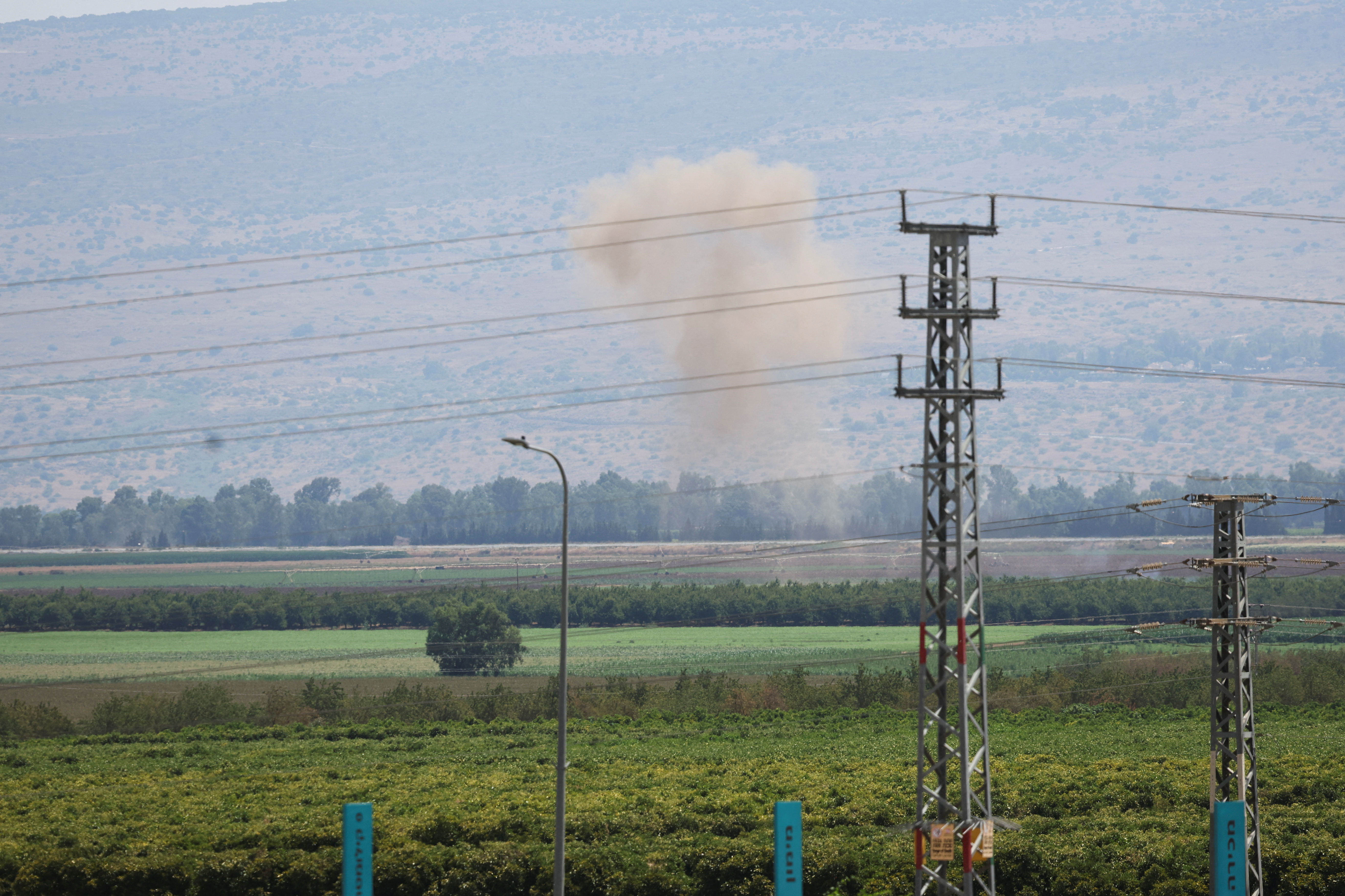 Smoke rises above the Israeli-occupied Golan Heights