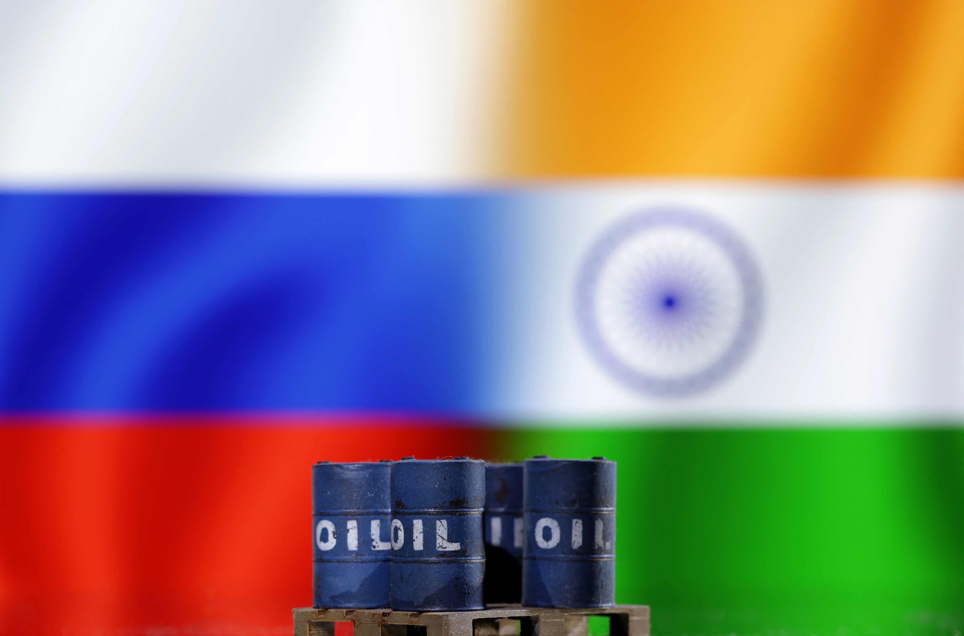 Illustration shows oil pump jack, Russian and Indian flags