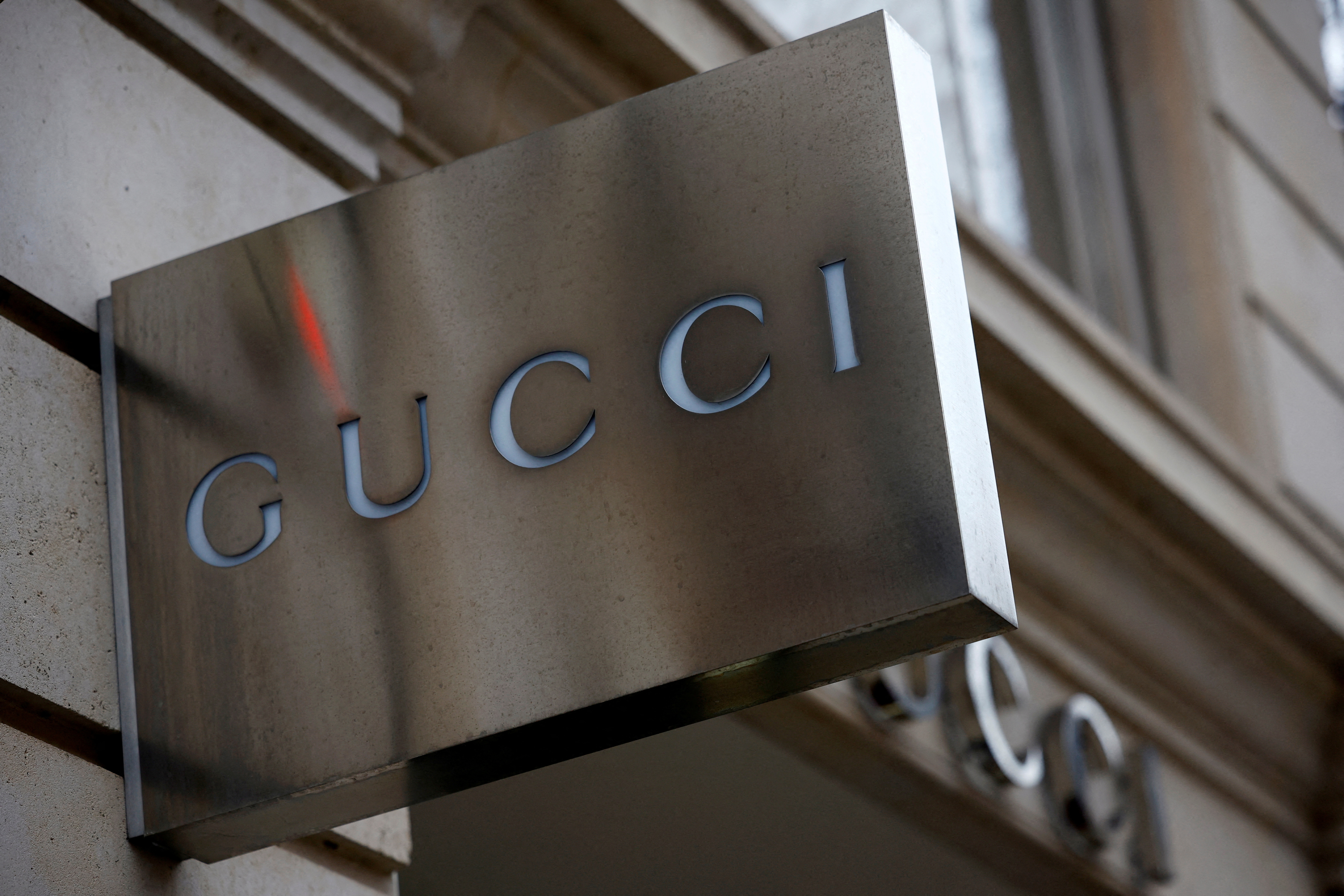 A Gucci logo is seen outside a shop in Paris