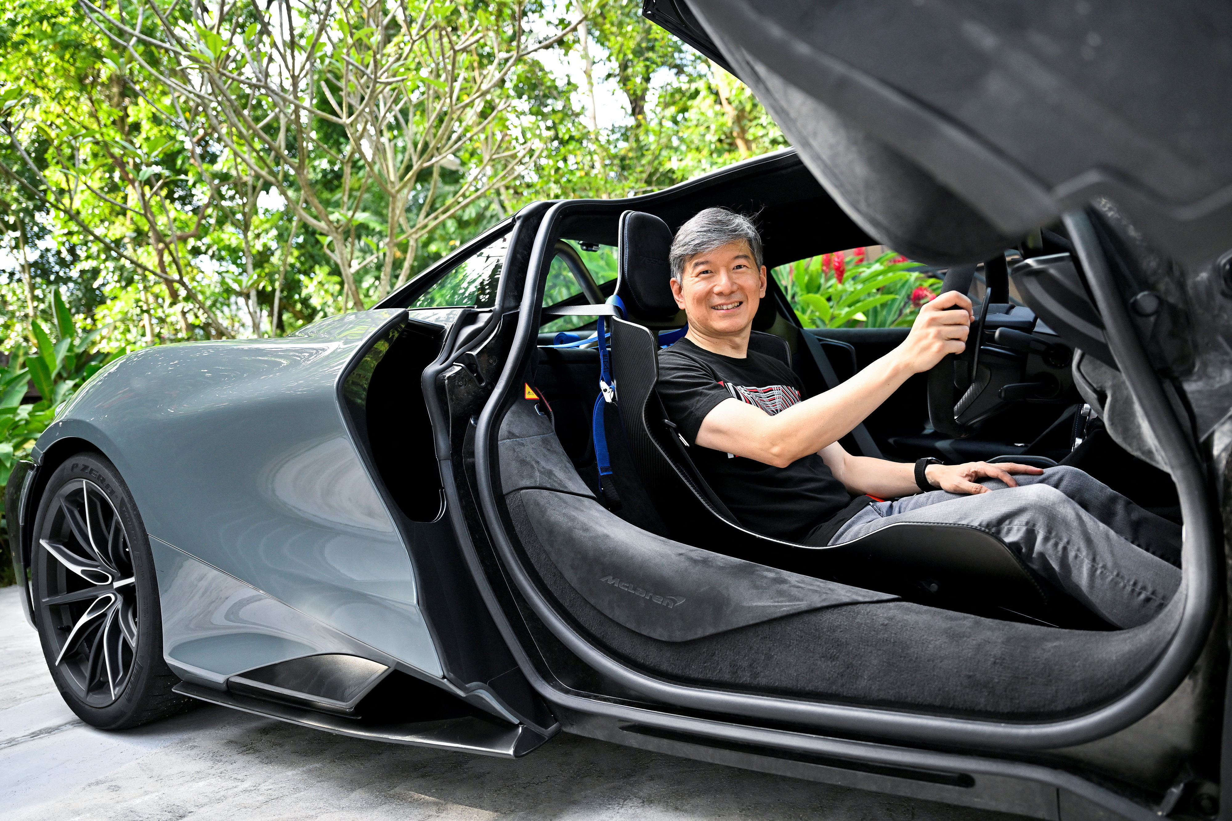 Eu Gene Goh poses for a picture in his McLaren 765LT in Singapore