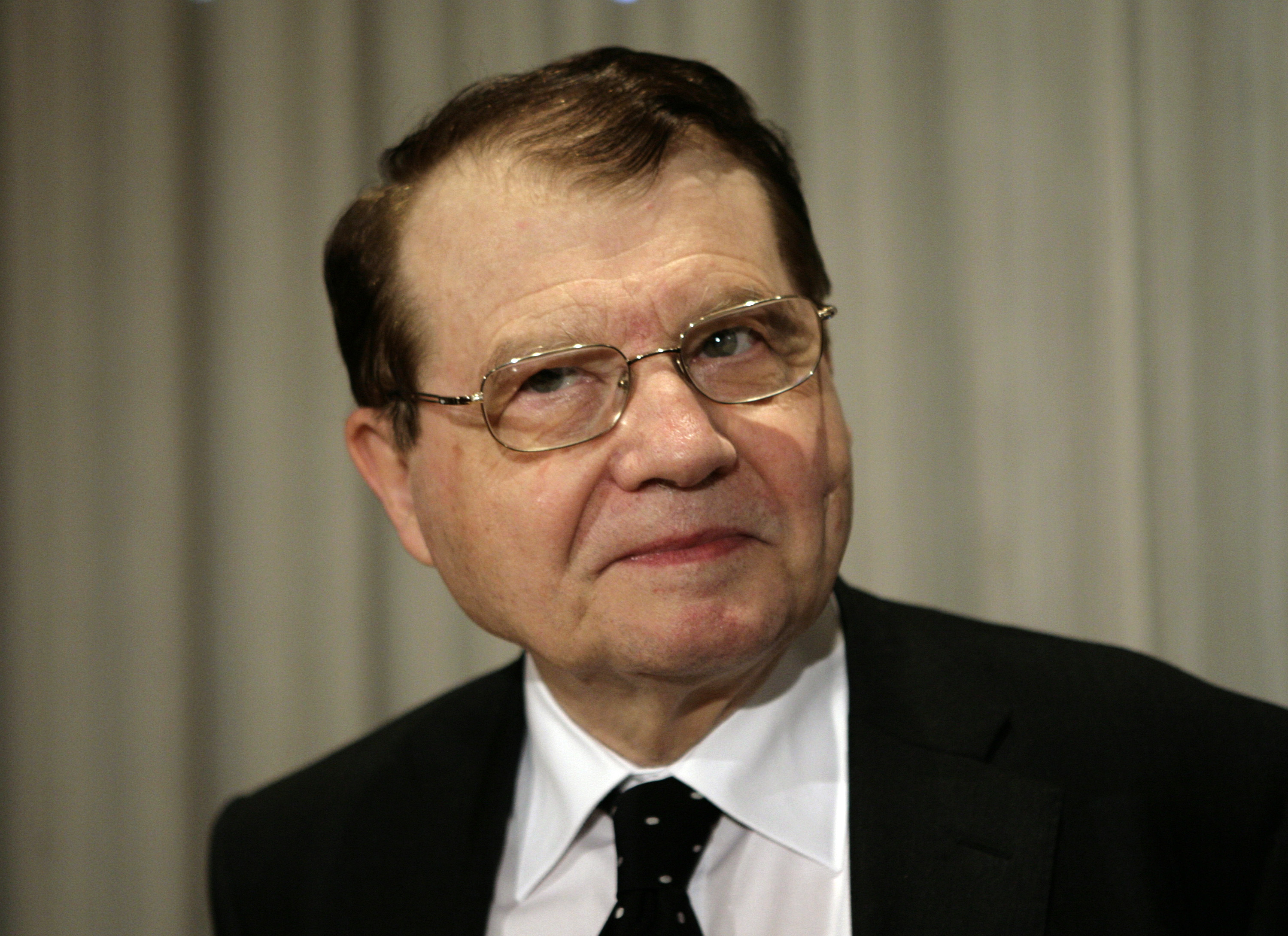 Dr. Luc Montagnier, co-discover of the Human immunodeficiency virus (HIV), arrives for a news conference at the National Press Club in Washington