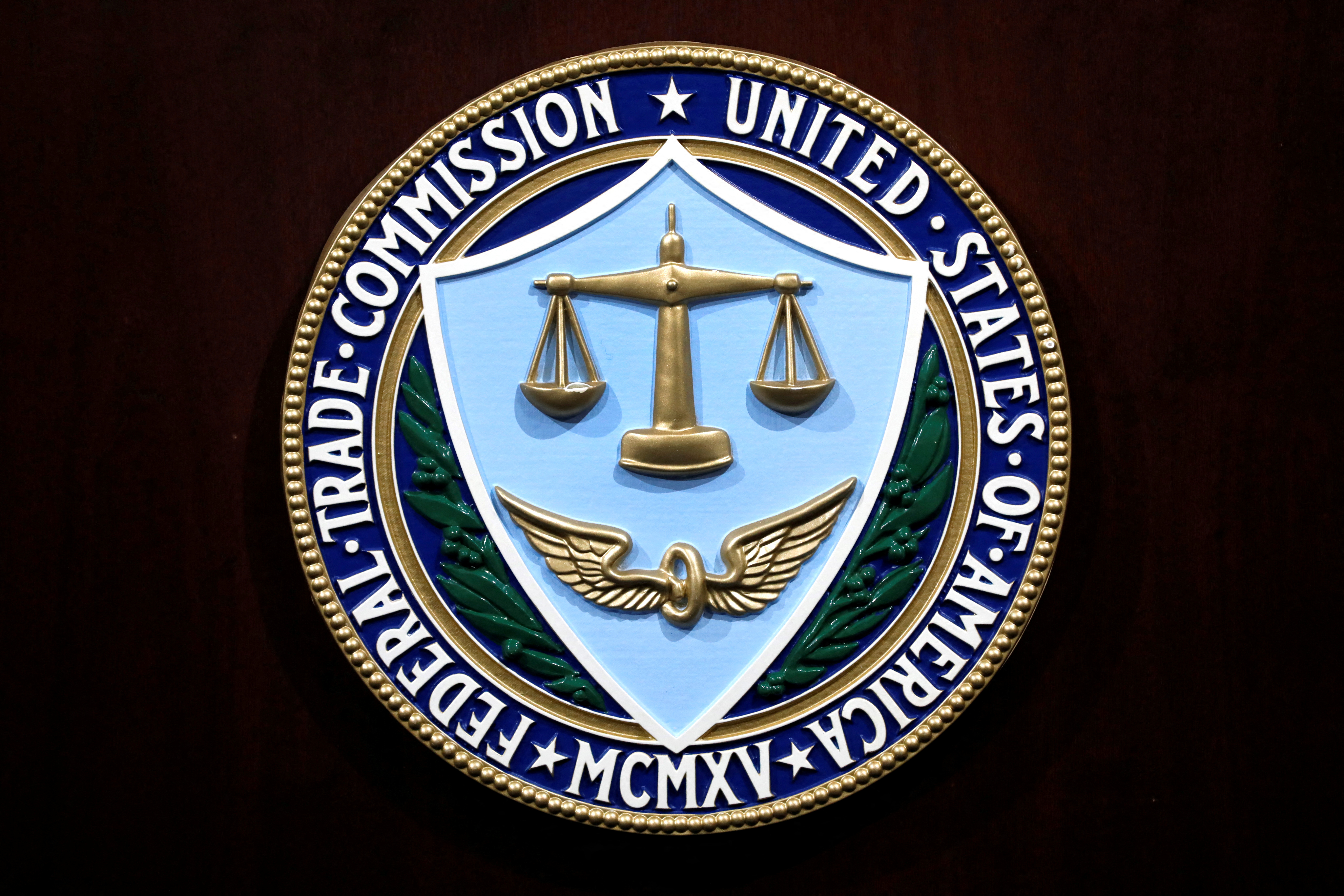 Federal Trade Commission seal is seen at a news conferenceat FTC Headquarters in Washington, U.S., July 24, 2019. REUTERS/Yuri Gripas/File Photo
