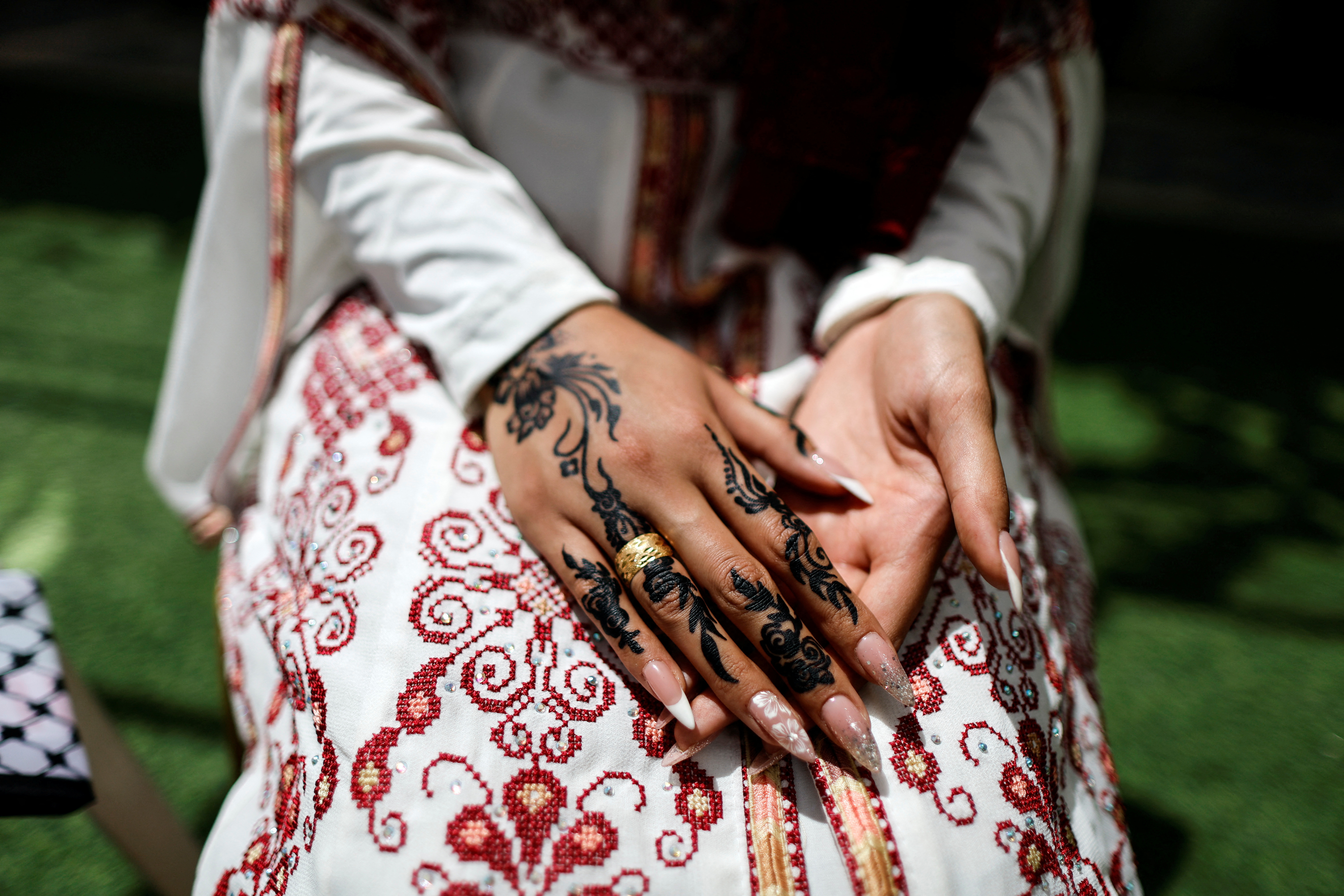 The hands of a Palestinian bride Rabeha Al-Rajabi is decorated with Henna for her wedding ceremony in her house in East Jerusalem