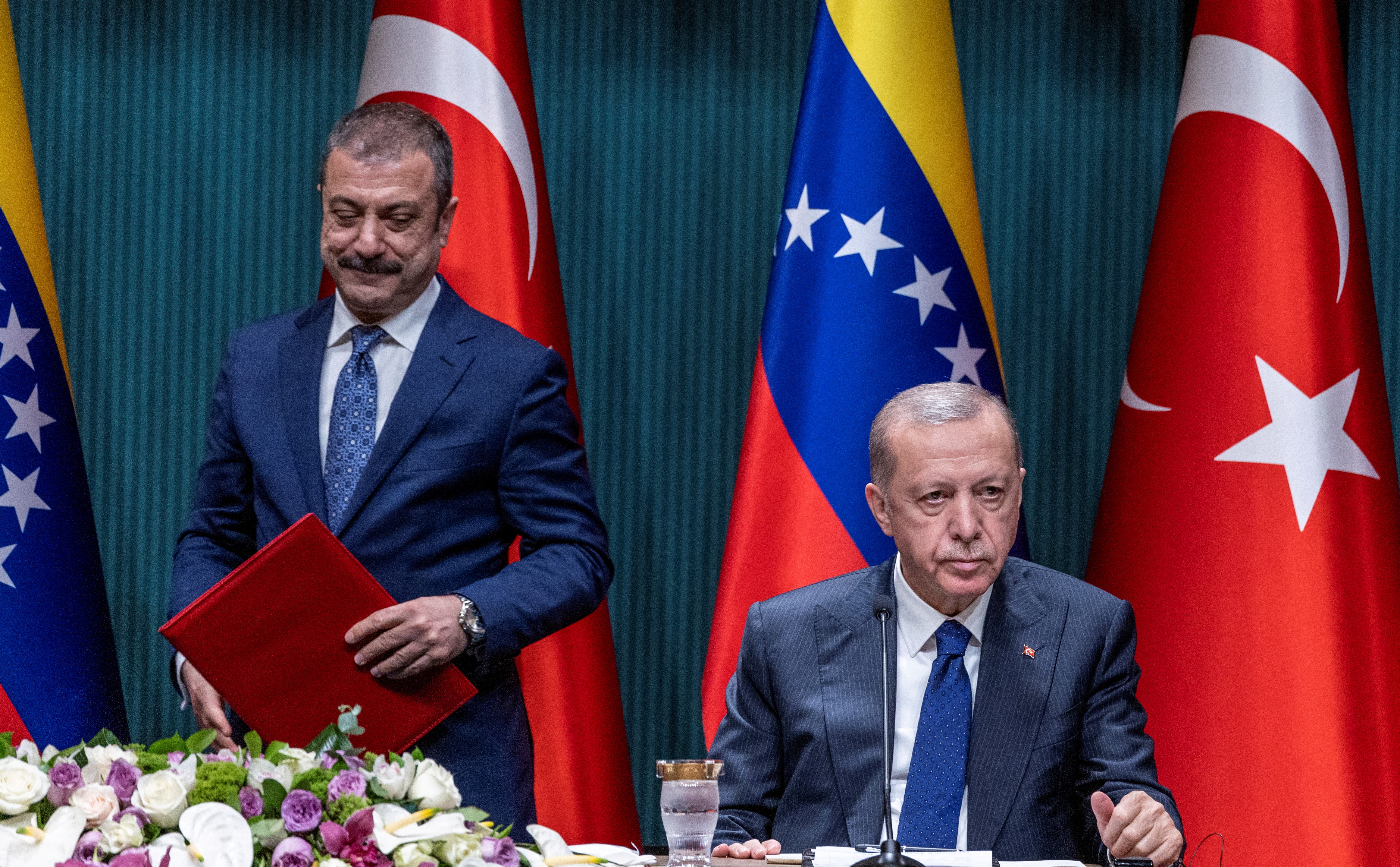 Turkish President Tayyip Erdogan and Central Bank Governor Sahap Kavcioglu are seen during a signing ceremony in Ankara