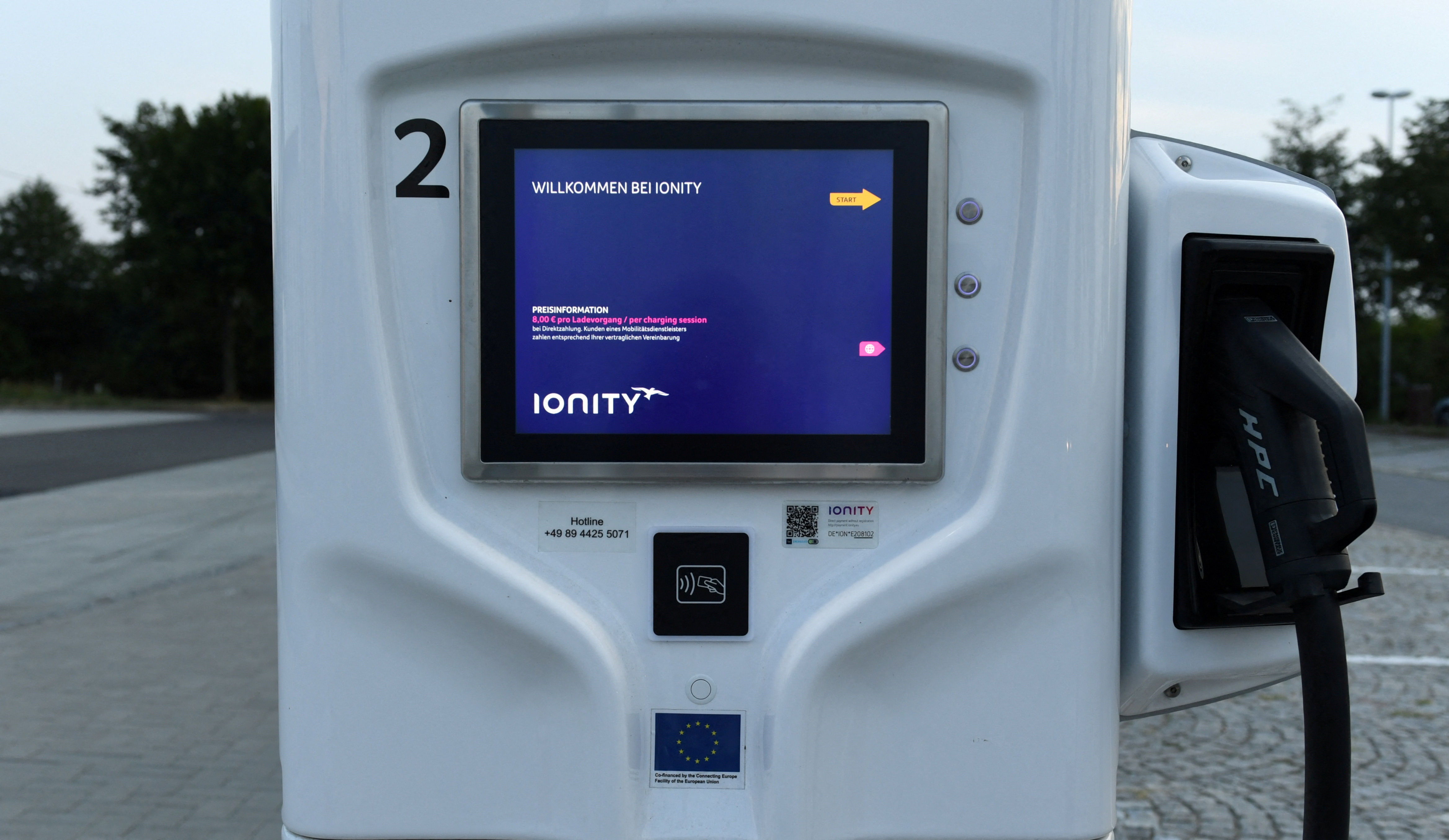 An electric vehicle charging station is seen on a motorway service station near Dresden